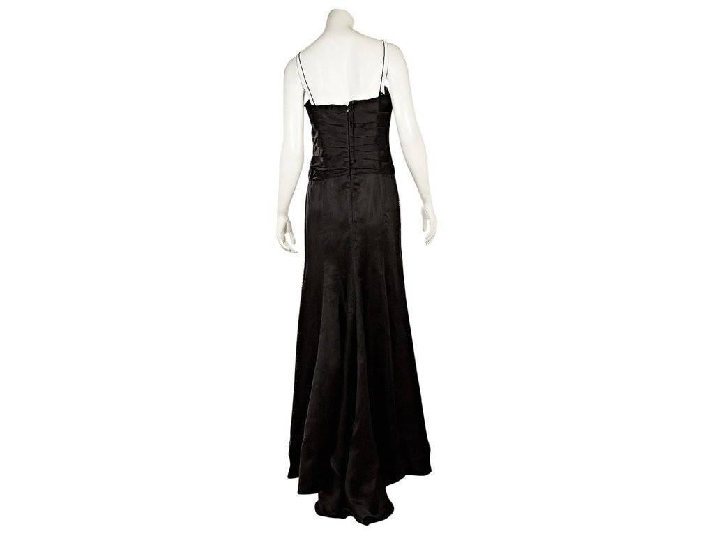 Product details:  ﻿Black silk evening gown by Armani Collezioni.  Pleated bodice.  Spaghetti straps.  Concealed back zip closure.  
Condition: Excellent.  