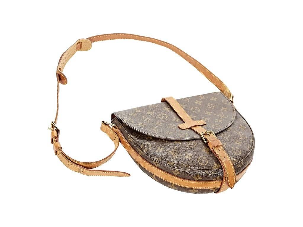Product details:  ﻿Brown monogram canvas crossbody bag by Louis Vuitton.  Adjustable crossbody strap.  Front flap with buckle closure.  Leather interior with inner zip pocket.  Goldtone hardware. ﻿ 10