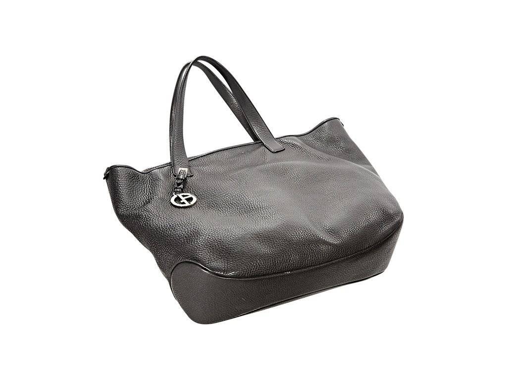 Product details:  Black leather tote bag by Giorgio Armani.  Top carry handles.  Adjustable bridge strap.  Lined interior with inner zip and slide pockets.  14.5