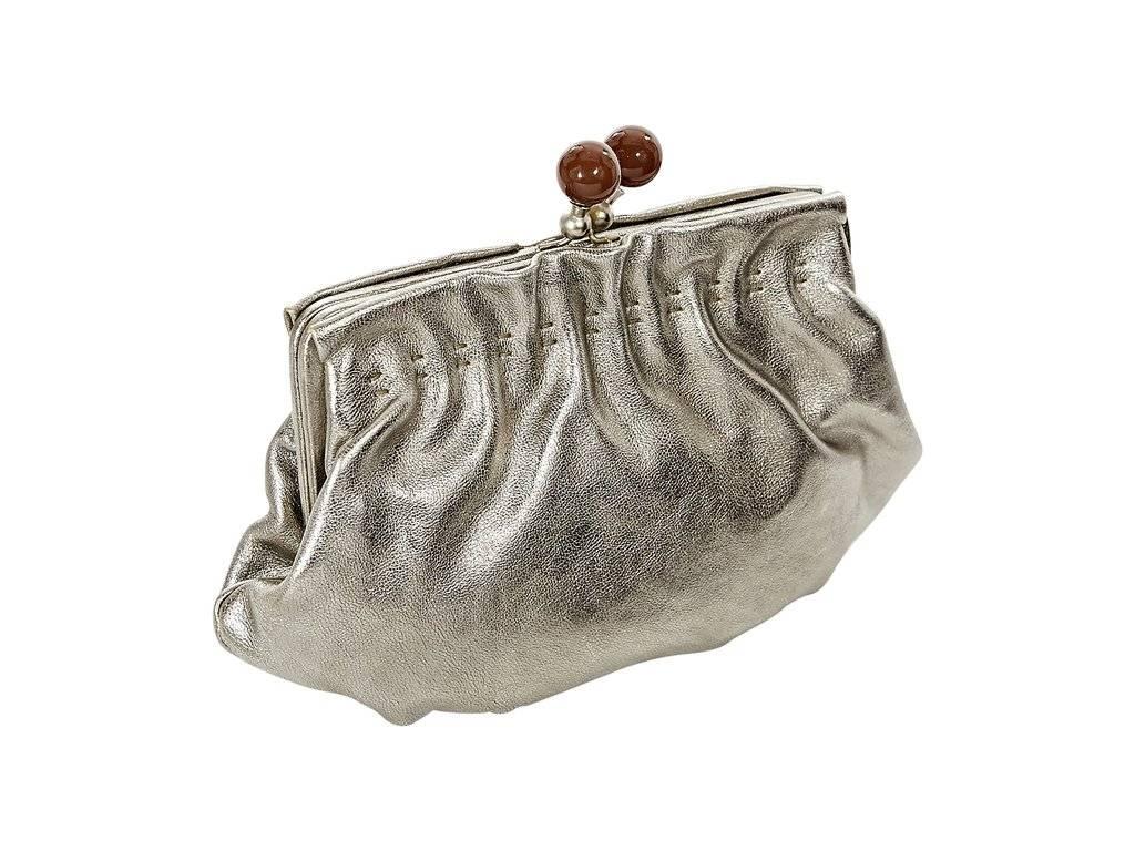 Product details:  ﻿Silver leather clutch by Marni.  Top kiss-lock closure.  Lined interior with inner zip pocket.  7