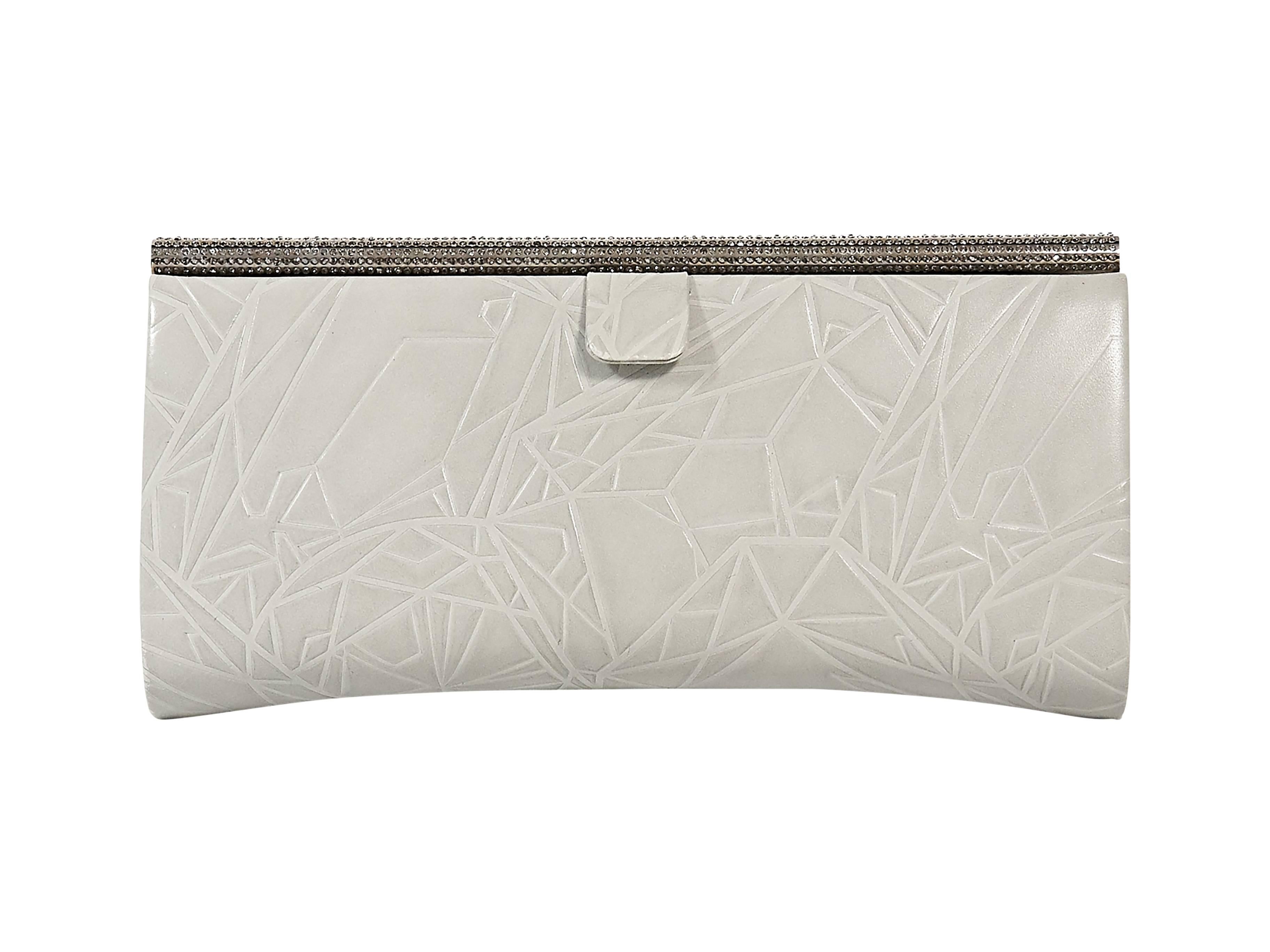 Product details: Grey embossed leather clutch by Swarovski. Crystallized top bar. Lined interior. 8.25"L x 4"H x 1.5"D.
Condition: Excellent. 