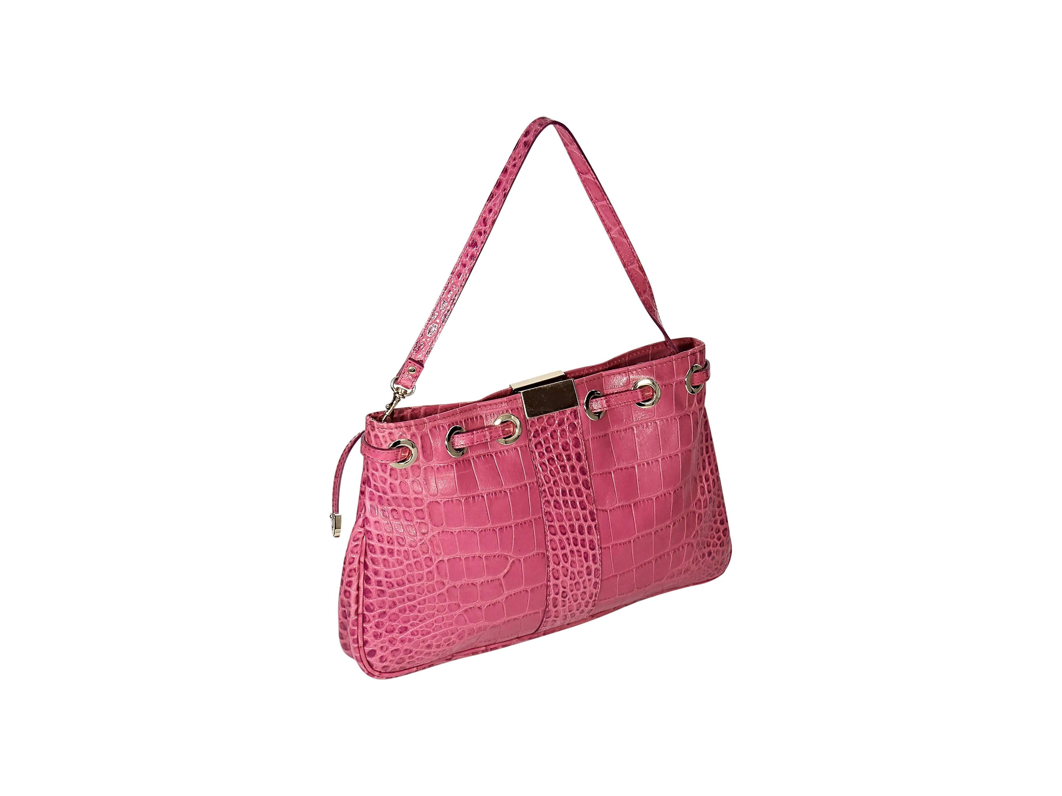Product details: Pink snake-embossed leather shoulder bag by Jimmy Choo. Detachable single shoulder strap. Top zip closure. Lined interior with inner pockets. Goldtone hardware. Authenticity card included. 12