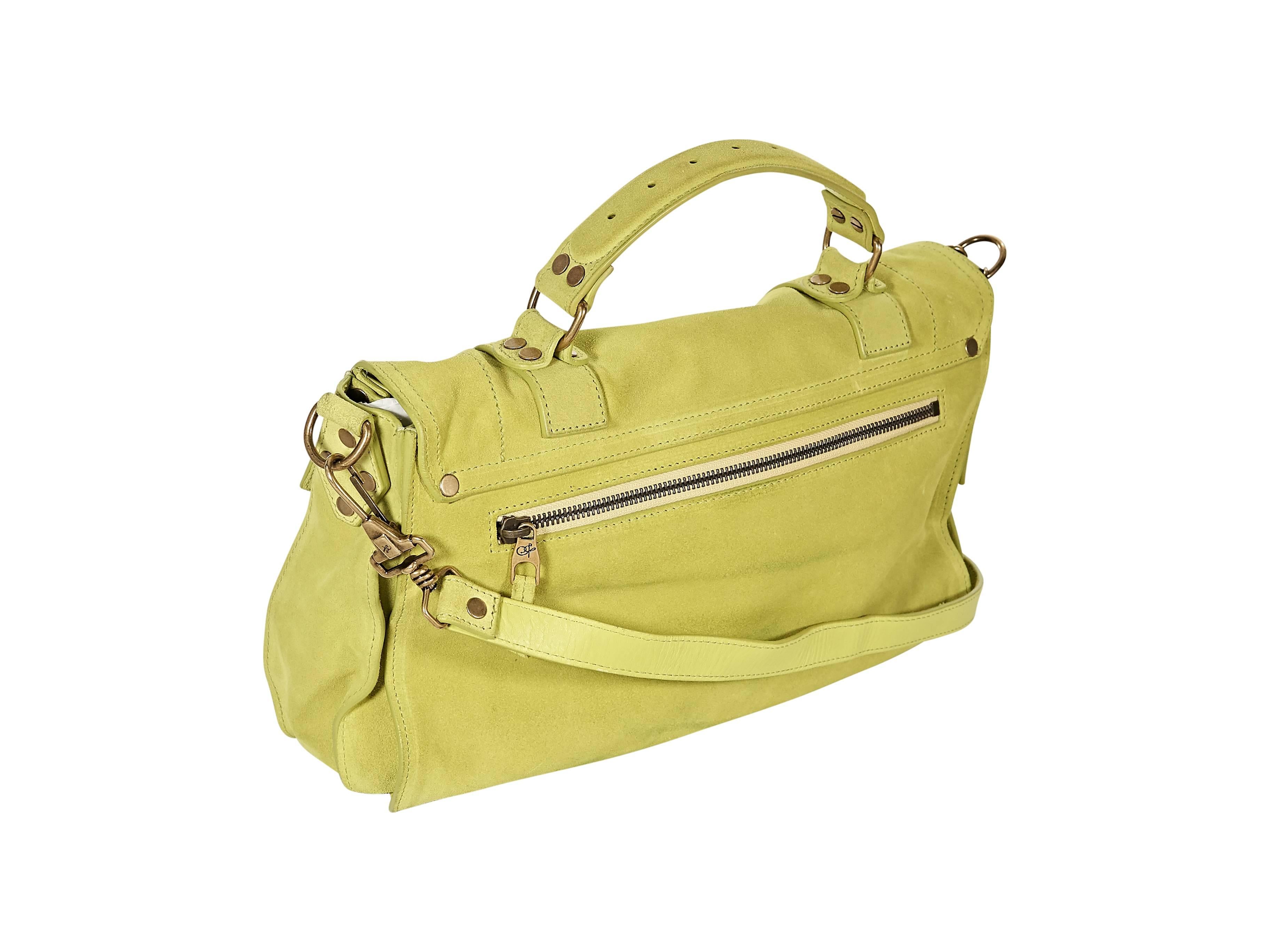 Product details: Lime green medium PS1 suede satchel by Proenza Schouler. Top carry handle. Detachable, adjustable crossbody strap. Zip and slide pockets under front flap. Flip-lock and double strap closure. Back exterior zip pocket. Lined interior
