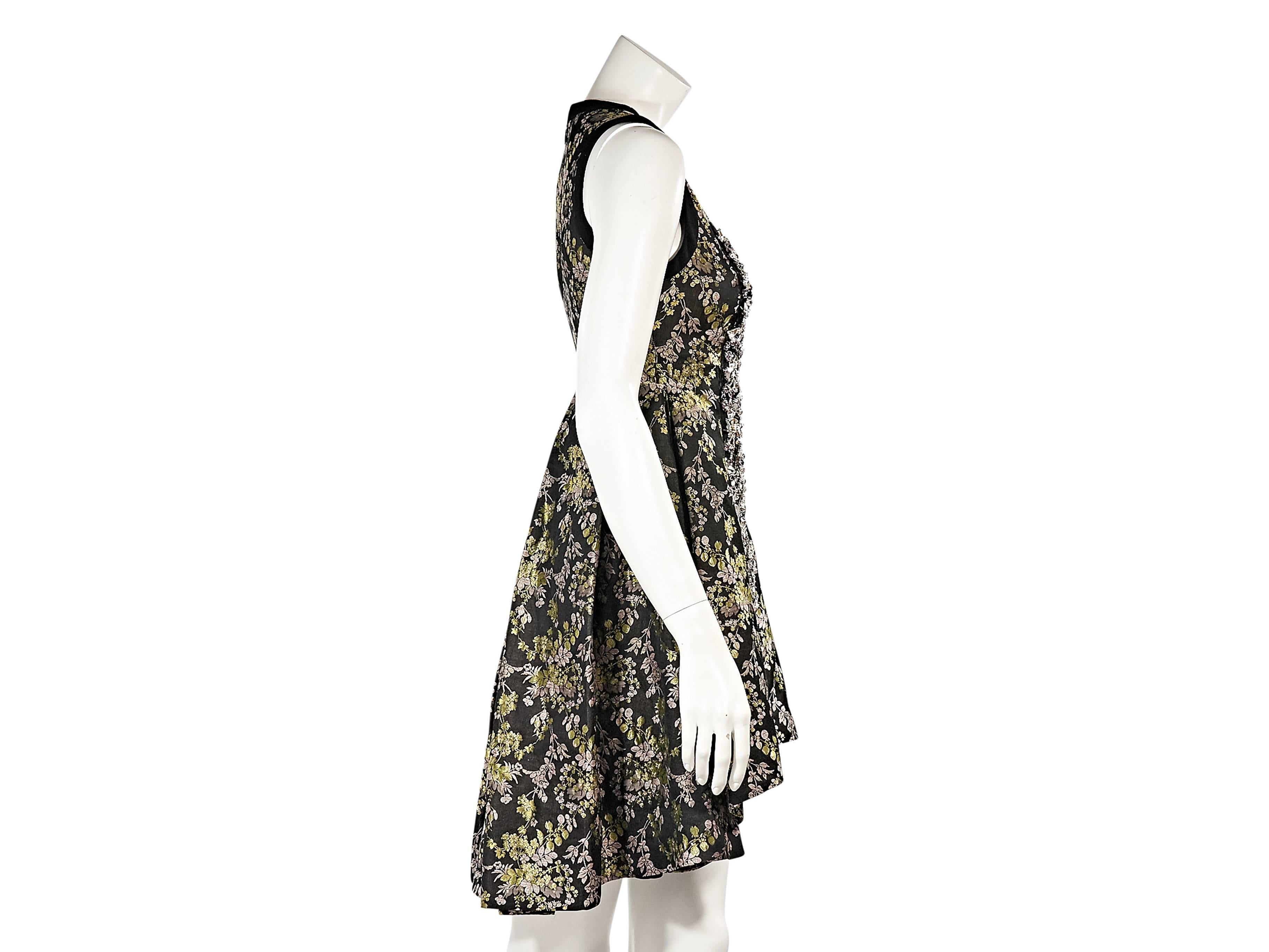 Product details:  Embellished front floral-printed dress by Vera Wang.  Scoopneck.  Sleeveless.  Concealed back zip closure.  Pleated back creates full skirting.  Hi-lo hem. 
Condition: Excellent. 
Estimated Retail: $2,990