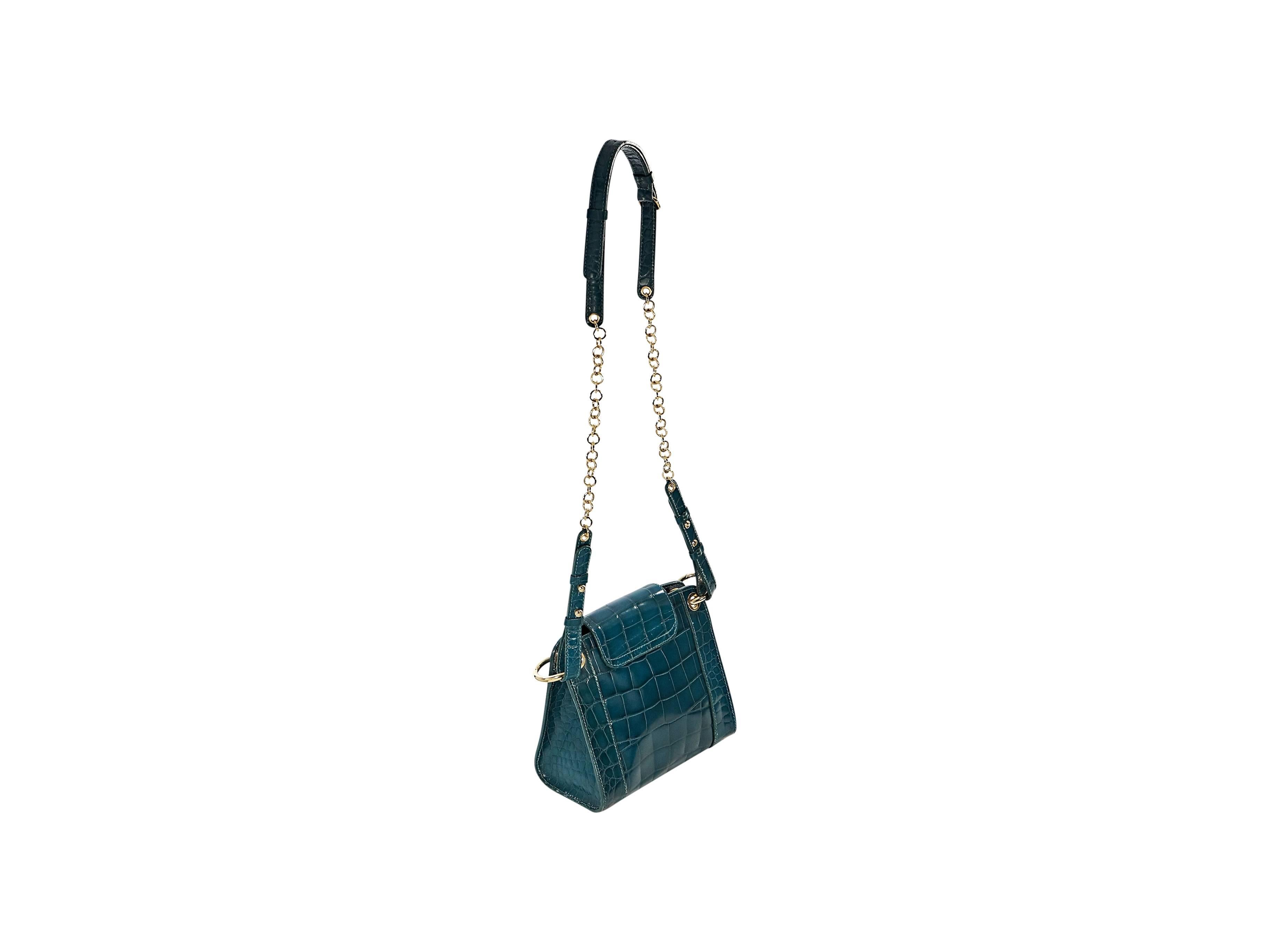 Product details:  ﻿Exotic teal alligator crossbody bag by Alberta Ferrerti.  Adjustable leather and chain crossbody strap.  Front flap with knocker accent. Concealed magnetic snap closure.  Lined interior.  Goldtone hardware.  7.25