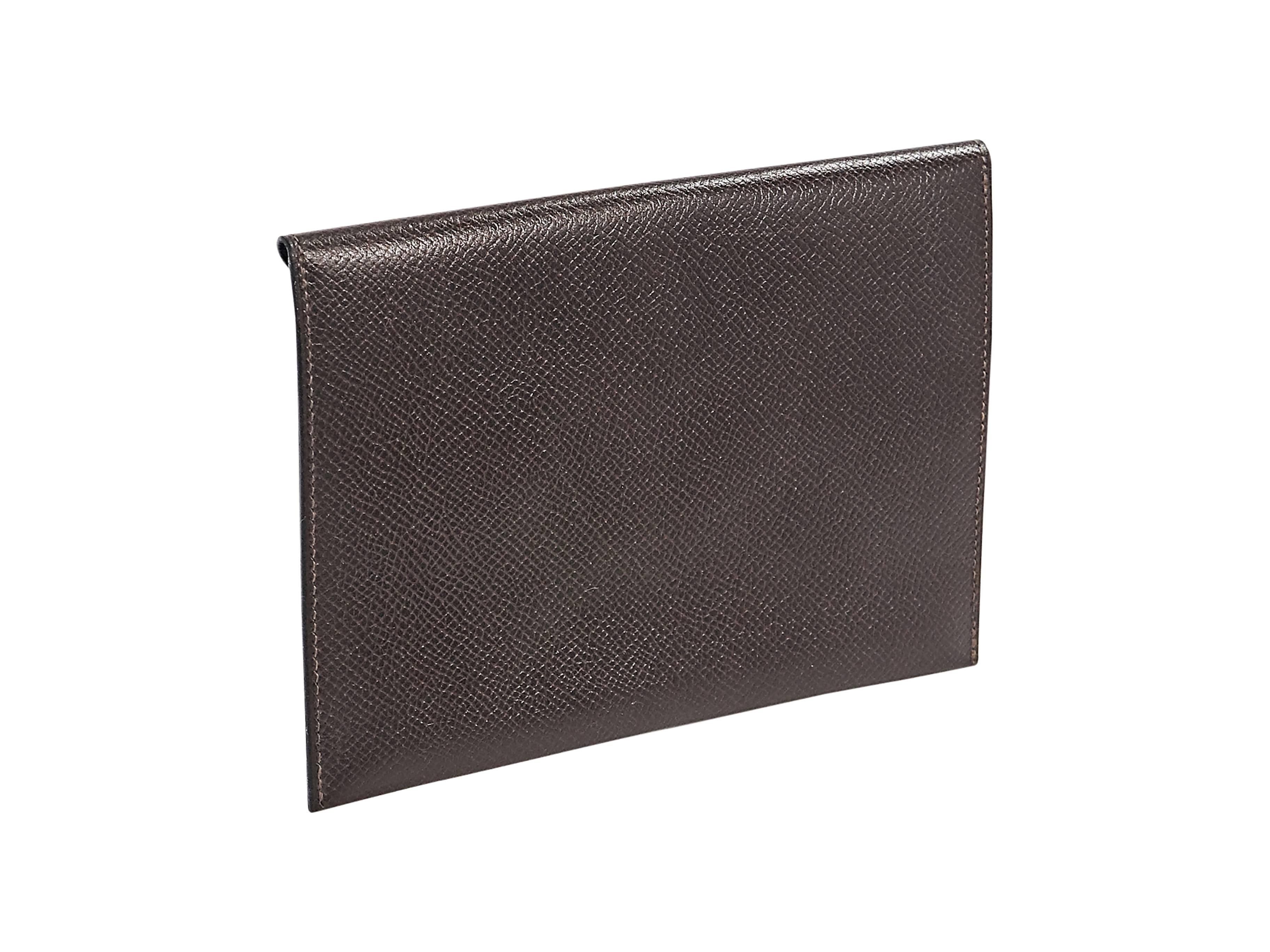 Product details:  Brown leather envelope clutch by Hermes.  Front flap closure.  6