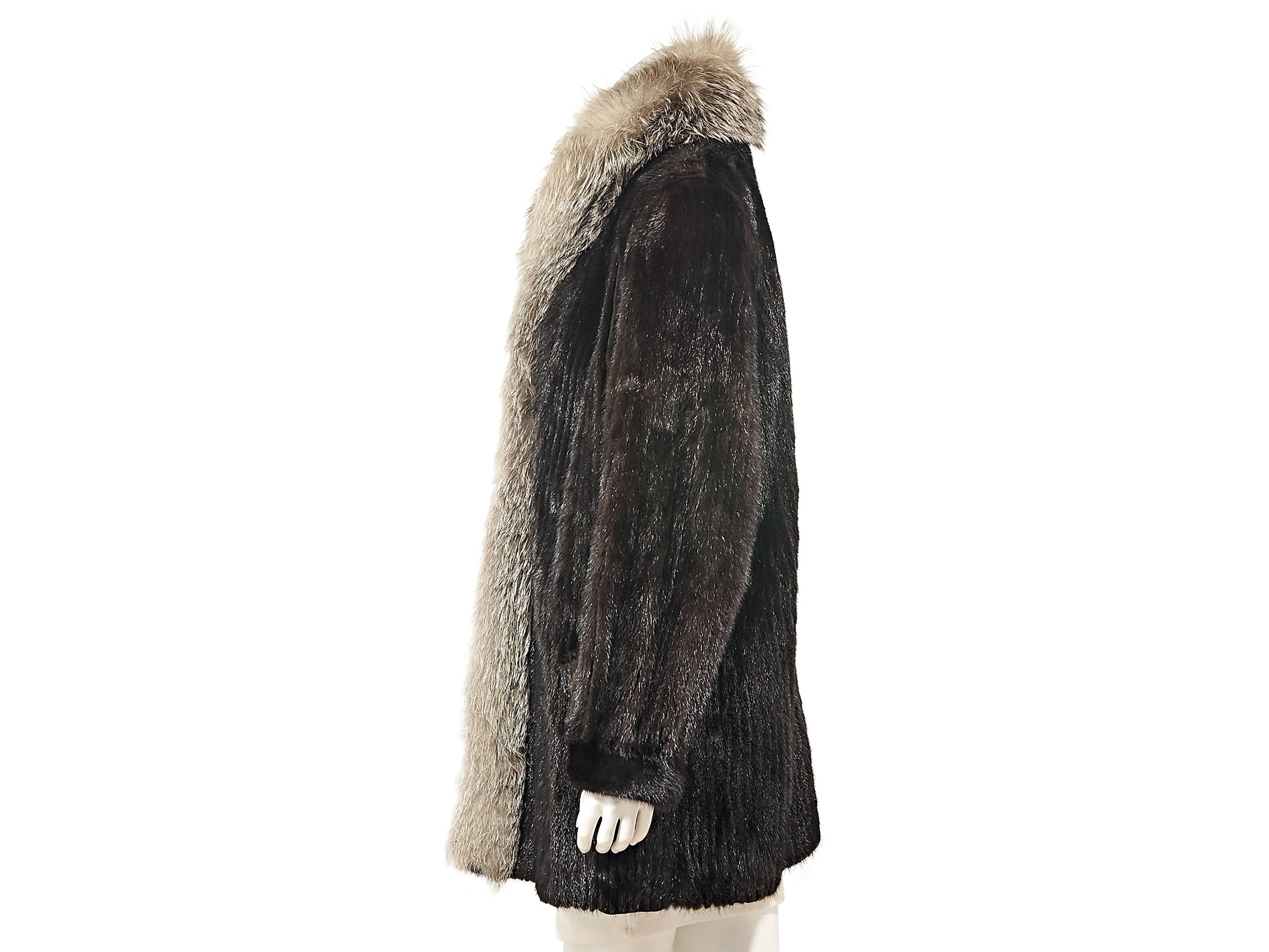 Product details:  Vintage brown mink fur coat.  Trimmed with grey fox fur.  Long sleeves.  Concealed closure. 
Condition: Excellent. 

