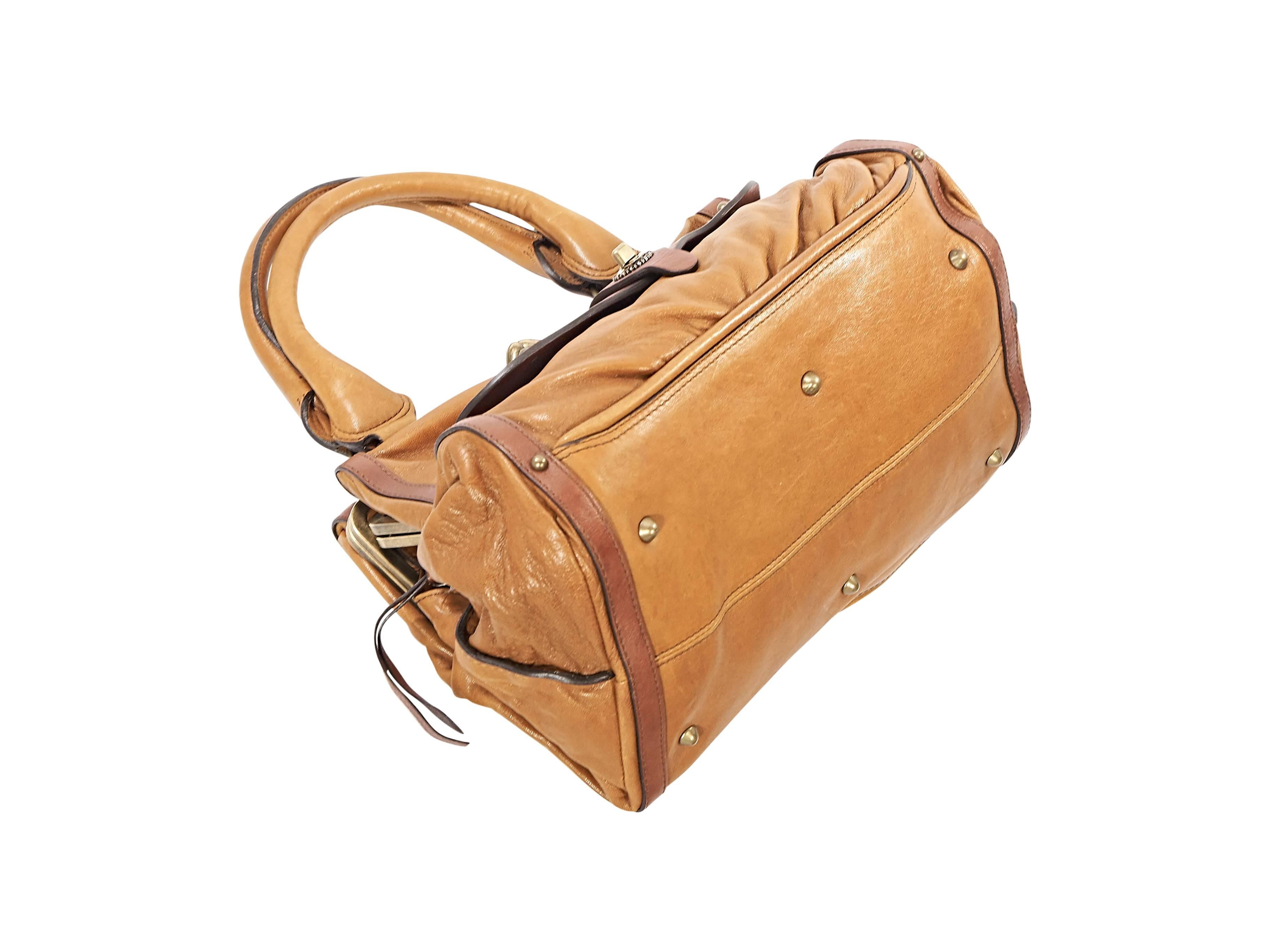 Product details:  Tan two-toned leather handbag by Chloe.  Dual carry handles.  Front twist-lock flap pocket.  Three main compartments.  Top zip, kiss-lock and push closures.  Lined interior with inner zip pockets.  Protective metal feet.  Antiqued