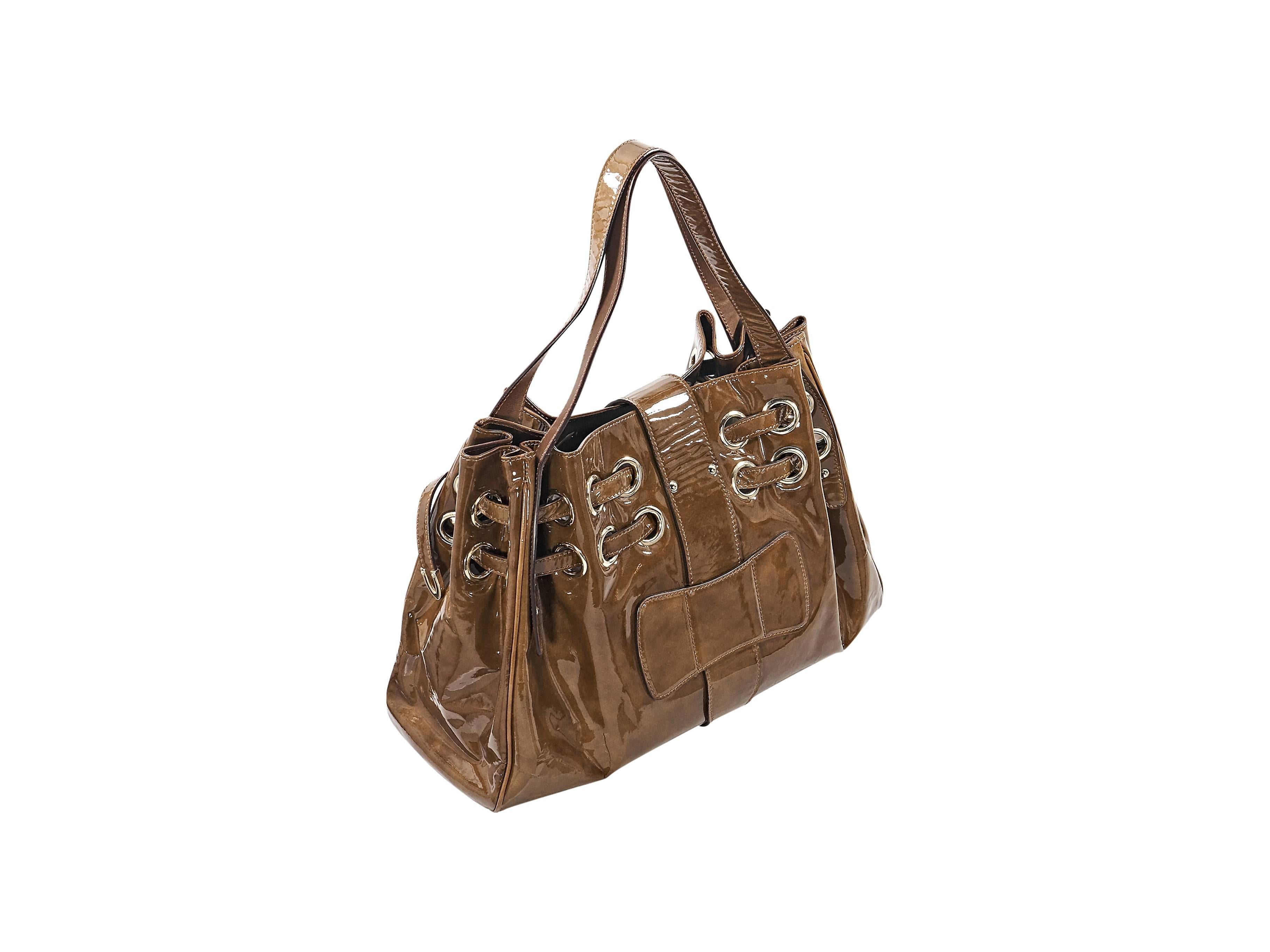 Product details: Brown patent leather 'Ramona' shoulder bag by Jimmy Choo. Dual shoulder straps. Flip-lock strap closure. Lined interior with inner zip pockets. Goldtone hardware. 16.5