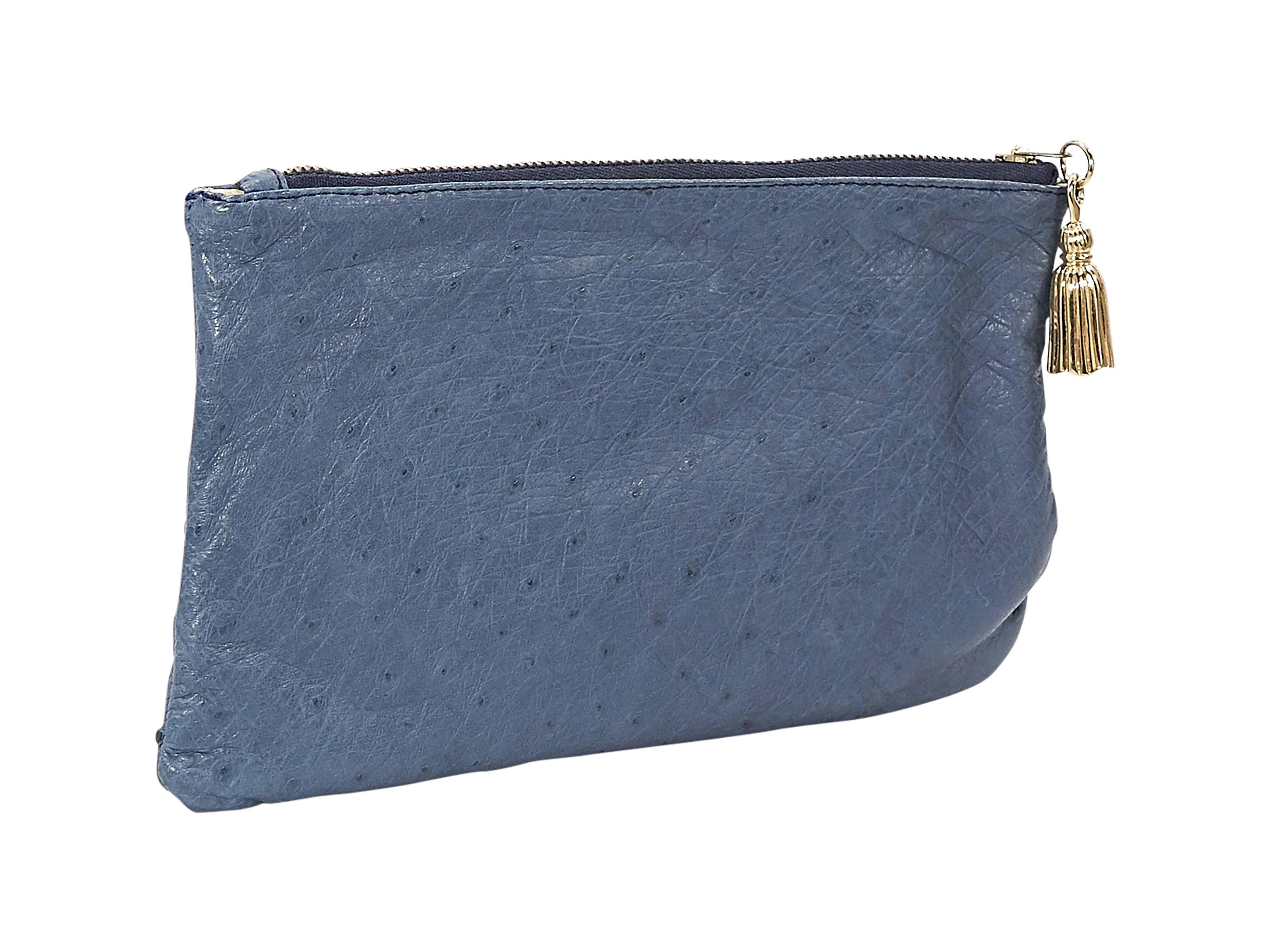 Product details: Blue ostrich clutch by Barfield. Top zip closure with tassel pull. Lined interior with inner slide pocket. Goldtone hardware.
Condition: Very good. Moderate exterior wear. Light interior wear.