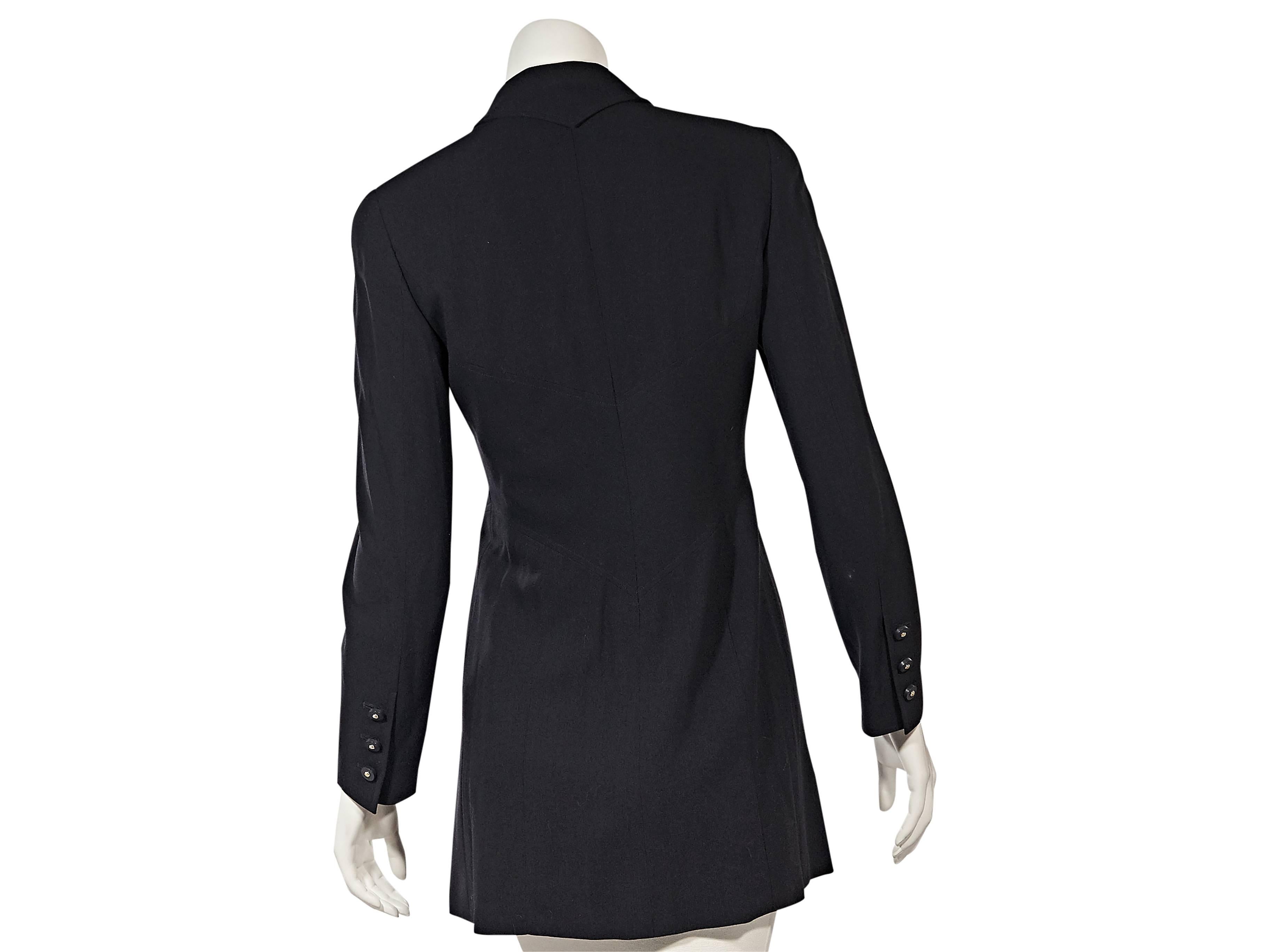 Product details: Vintage navy jacket by Chanel. Peaked lapel. Long sleeves. Three-button detail at cuffs. Button-front closure. Fitted bodice. Waist slash pockets. 
Condition: Very good. 