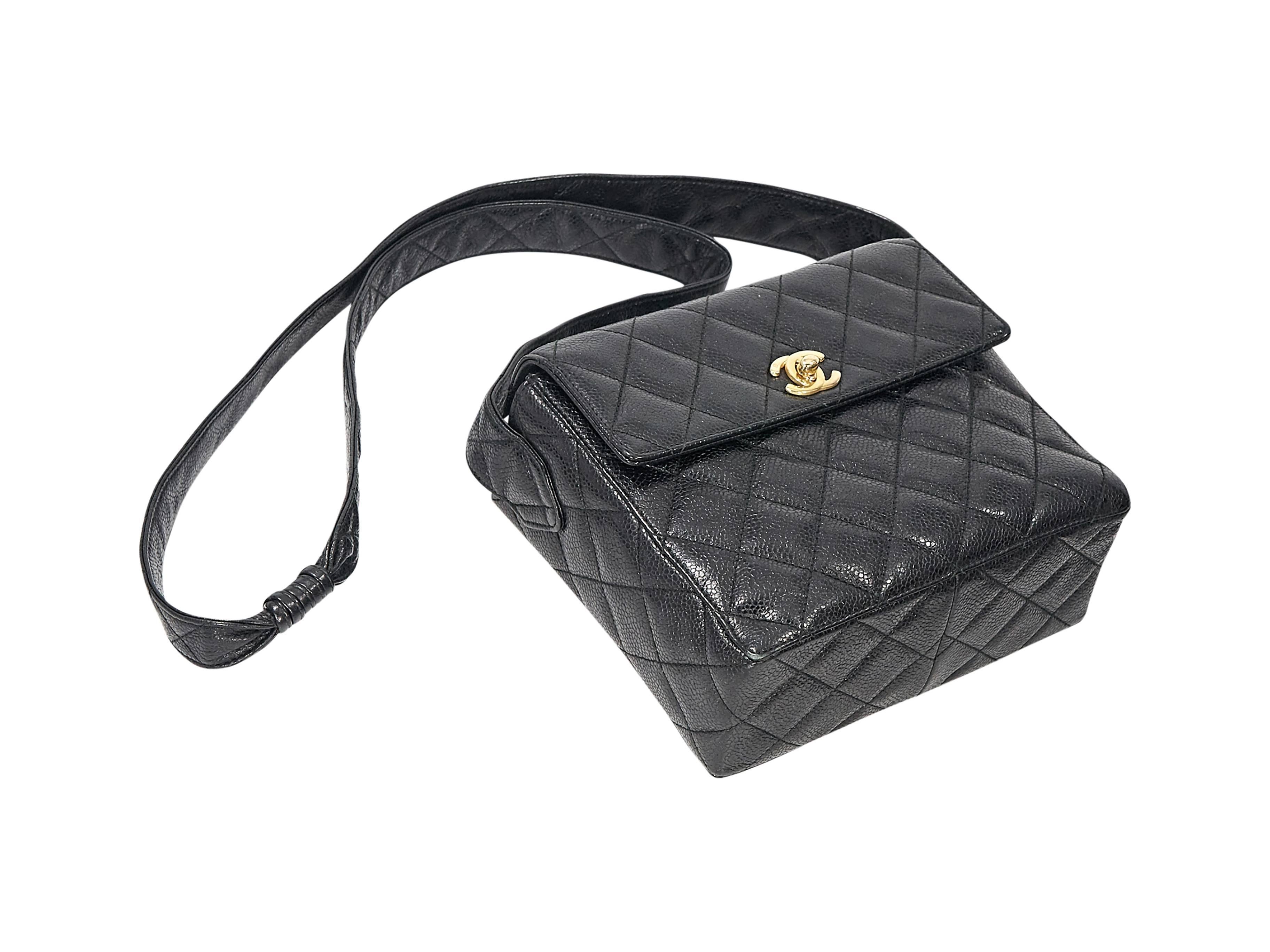 Product details: Black caviar leather quilted crossbody bag by Chanel. Crossbody stap. Twist-lock closure on front flap. Leather lined interior with inner mirror, slide and zip pockets. Back exterior slide pocket. Goldtone hardware. Authenticity