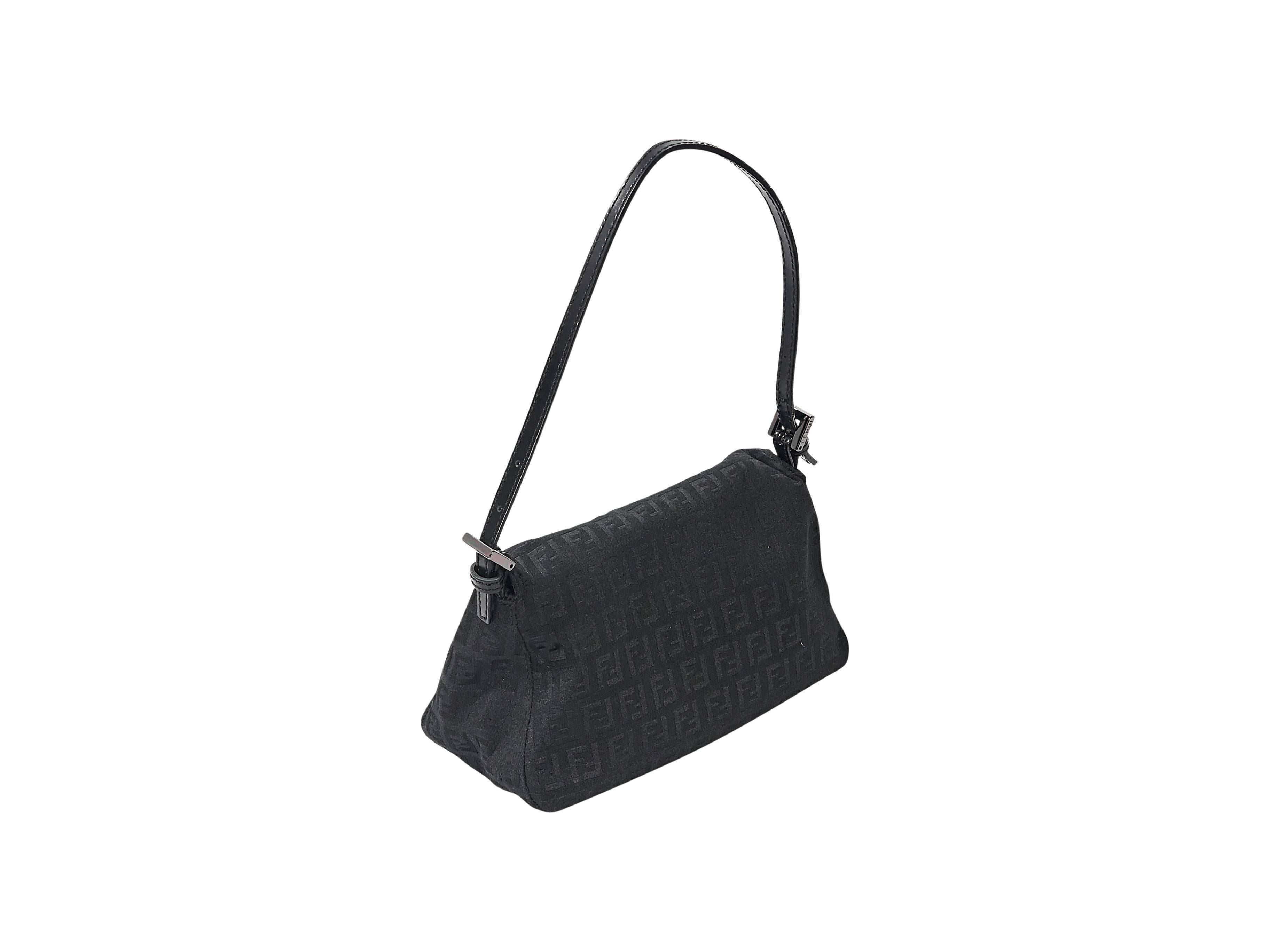 Product details:  Black Zucca baguette bag by Fendi.  Single shoulder strap.  Front flap.  Lined interior with inner slide pocket.  Silvertone hardware.  8.5