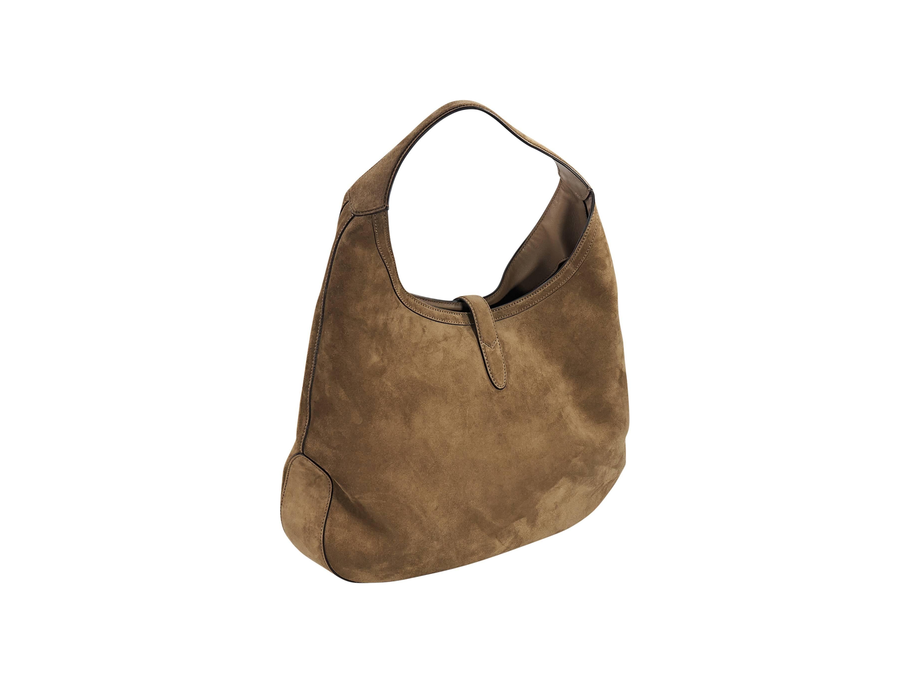 Product details:  Tan suede hobo bag by Gucci.  Features front signature logo stripes.  Single shoulder strap.  Top strap with clasp closure.  Lined interior with detachable pouch.  Goldtone hardware.  16.5