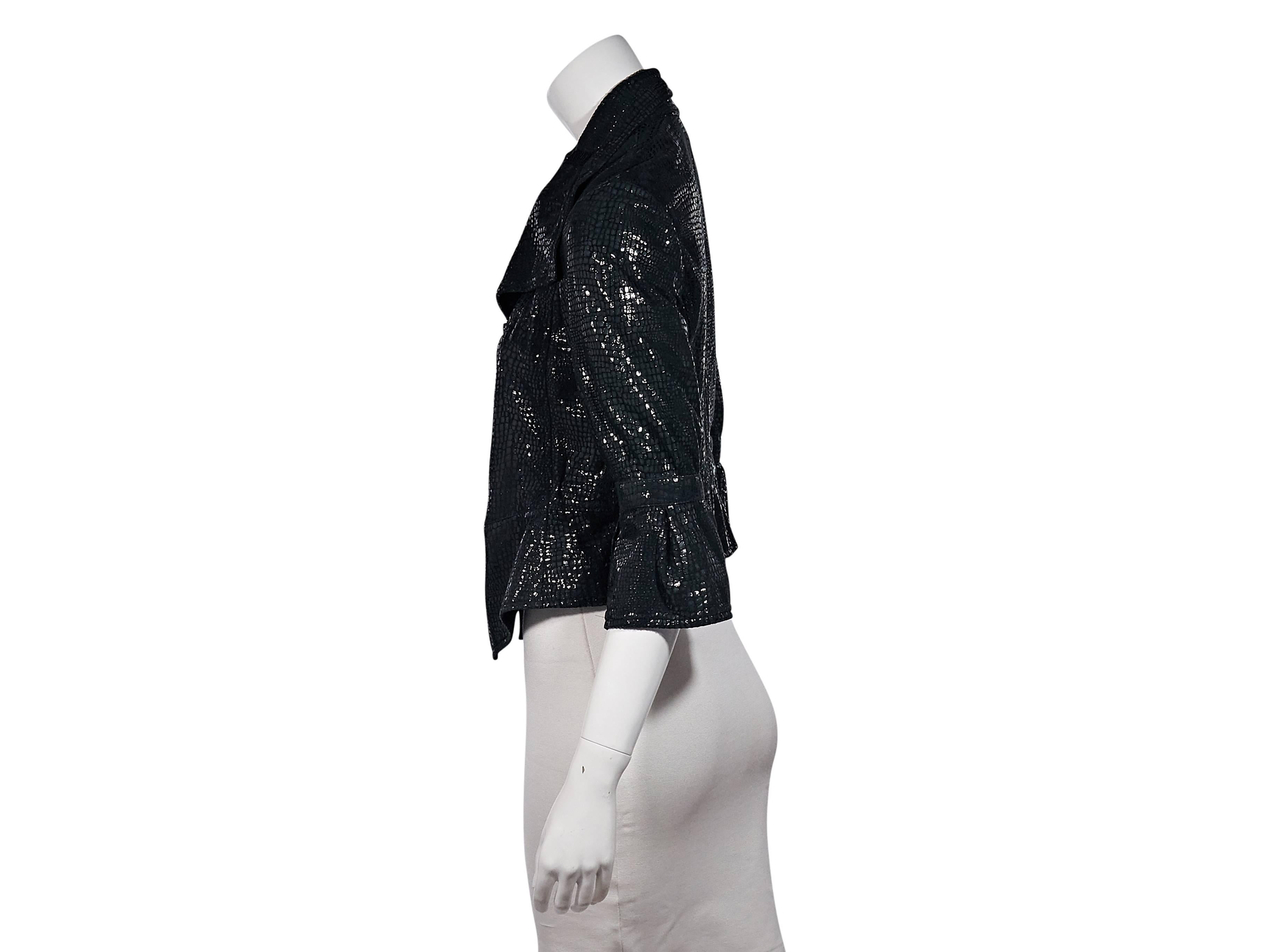 Product details: Black reptile-printed leather jacket by Armani Collezioni. Features a shine finish. Elbow-length sleeves. Bell cuffs. Asymmetrical zip-front closure. Label size IT38.
Condition: Excellent. 