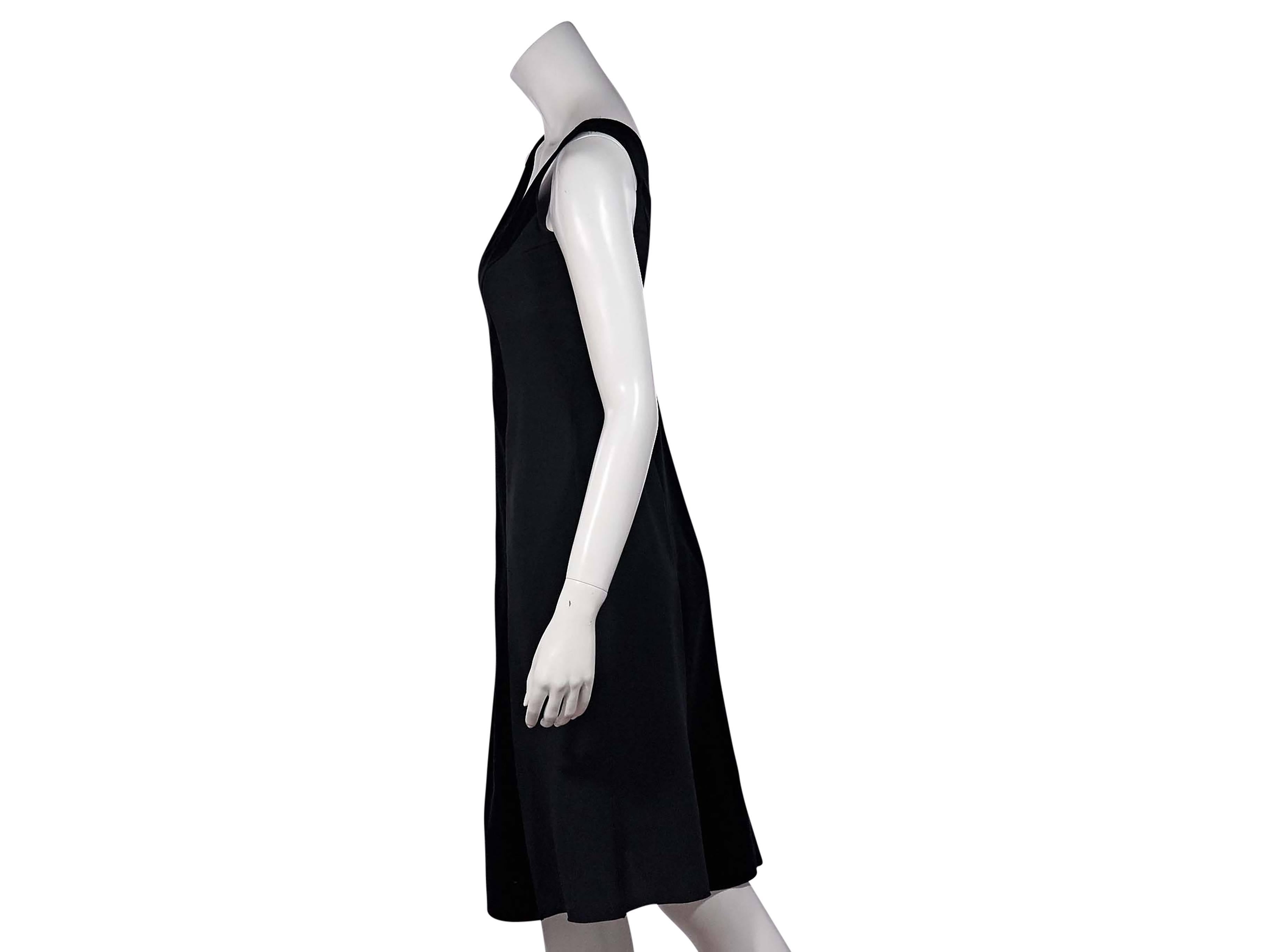 Product details: Black sheath dress by Prada. Accented with velvet front and back panels. Deep v-neck. Sleeveless. Concealed zip closure. 
Condition: Excellent. 
Est. Retail $ 828.00
