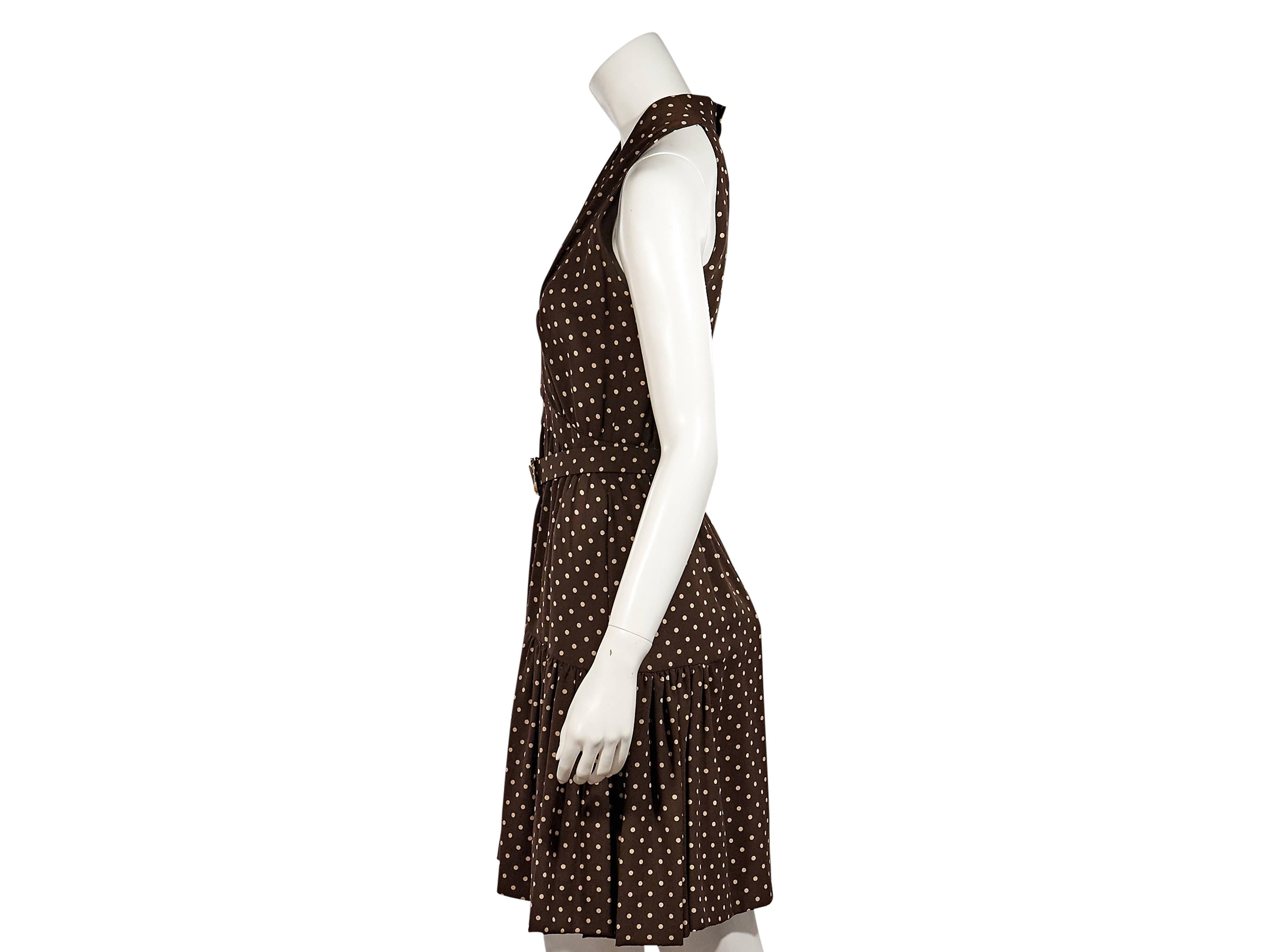 Product details:  Brown vintage polka dot dress by Chanel.  V-neck.  Sleeveless.  Adjustable belted waist.  Concealed back zip closure with double buttons.  Back slit.  
Condition: Excellent. 
Est. Retail $ 1,498.00