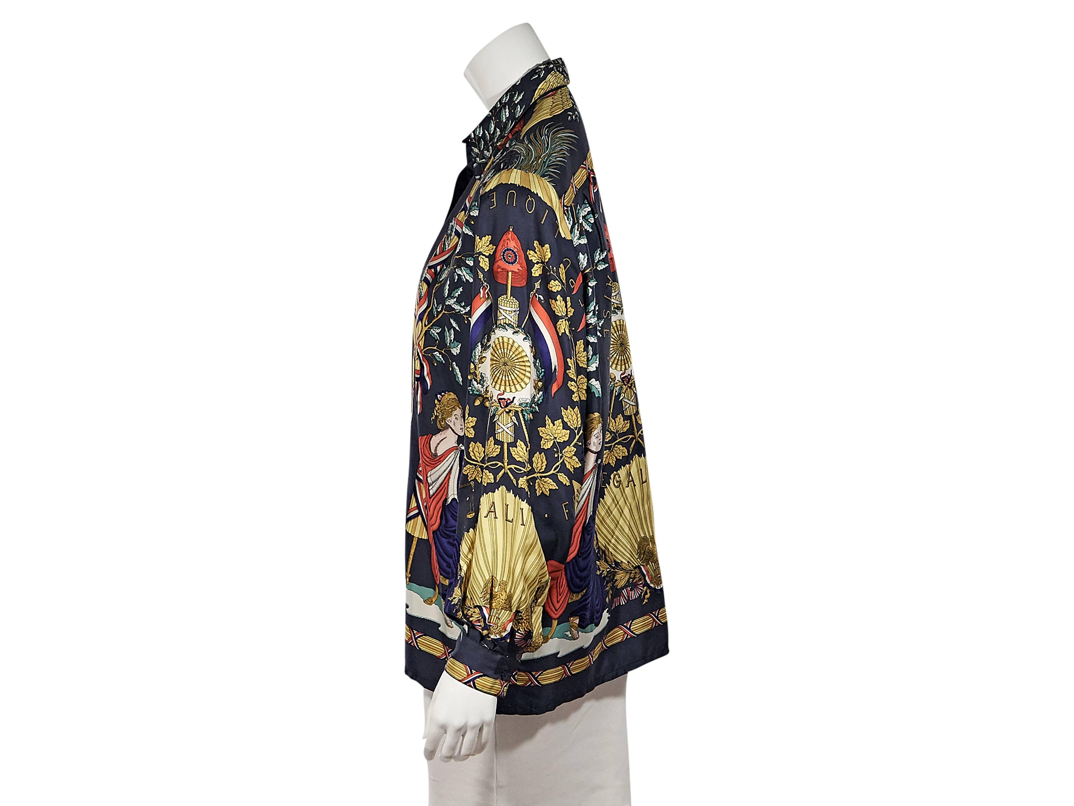 Product details:  Vintage multicolor Grecian printed silk top by Hermes.  Point collar.  Long sleeves.  Single button cuffs.  Button-front closure.  
Condition: Excellent. 
Est. Retail $ 1,228.00