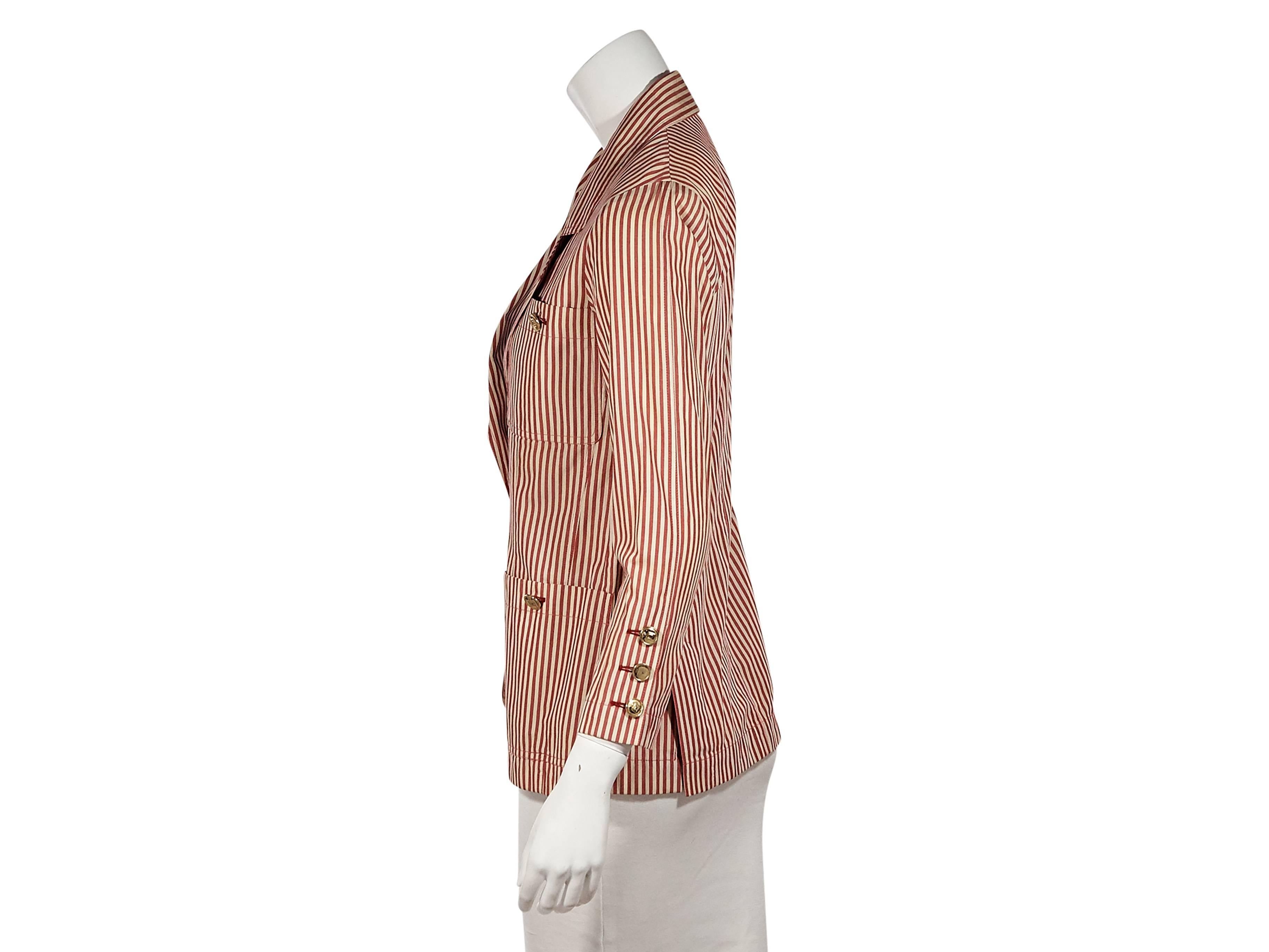 Product details:  Vintage red and white striped jacket by Chanel.  Notched lapel.  Bracelet-length sleeves.  Three-button detail at cuffs.  Button-front closure.  Four front button patch pockets.  Double back hem vents.  Label size FR 36.