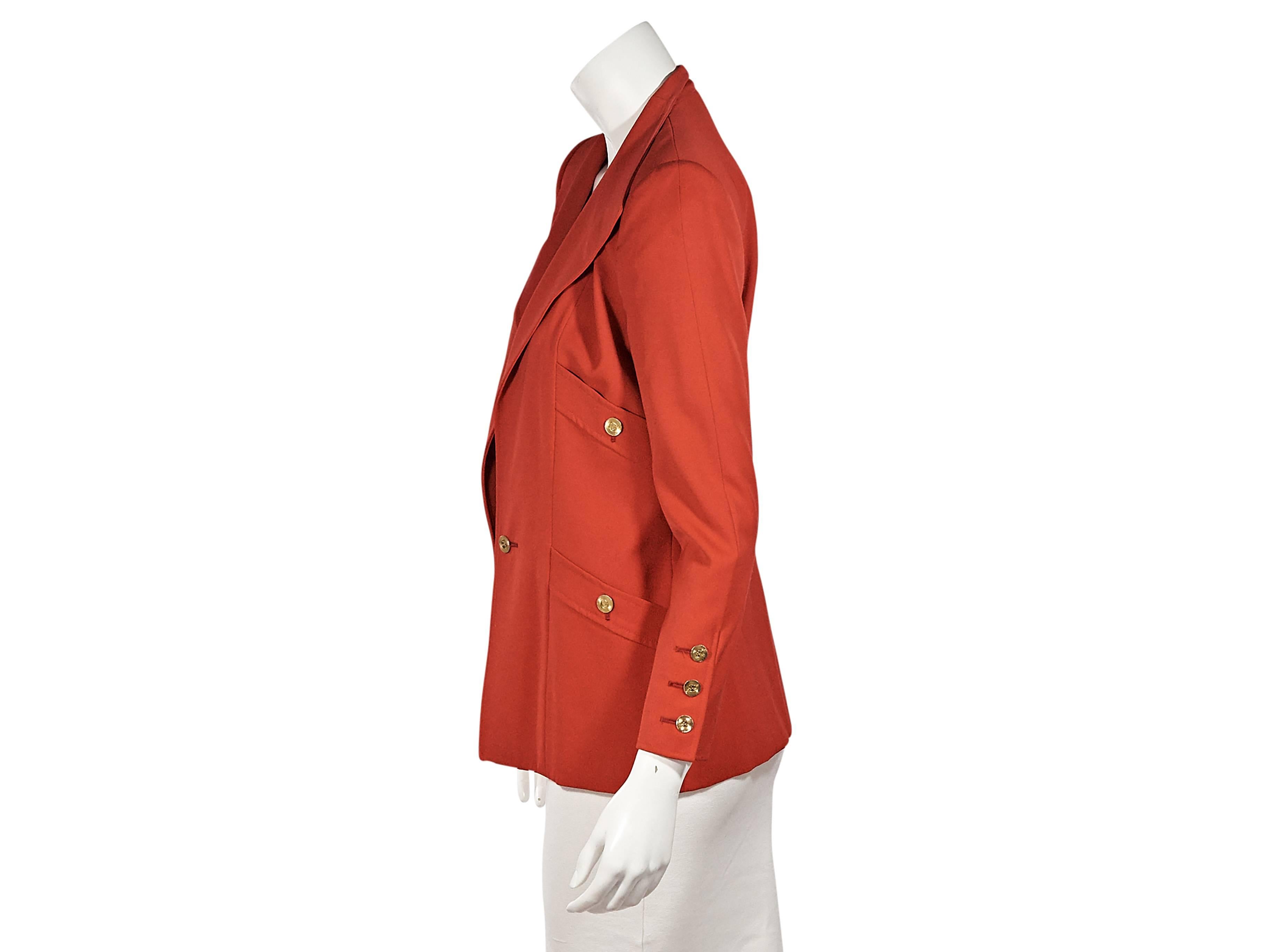 Product details:  Vintage red jacket by Chanel.  Bracelet-length sleeves.  Triple-button detail at cuffs.  Button-front closure.  Four front button patch pockets.  Label size FR 36.  
Condition: Excellent. 
Est. Retail $ 1,298.00