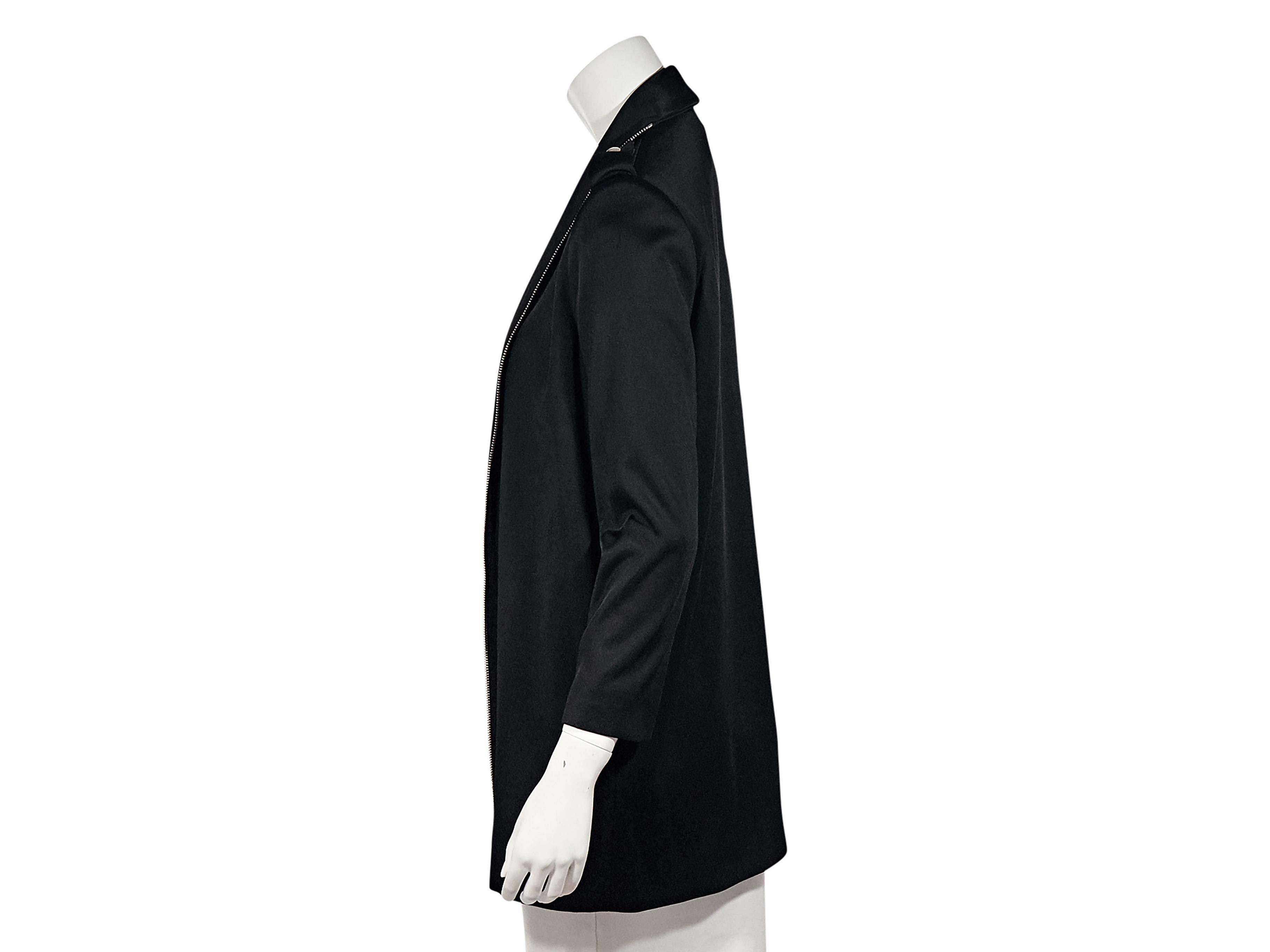 Product details:  Black wool open-front jacket by Bouchra Jarrar.  Shoulder epaulettes.  Bracelet-length sleeves.  Open front trimmed with zipper placket.   
Condition: Excellent.
Est. Retail $ 2,170.00