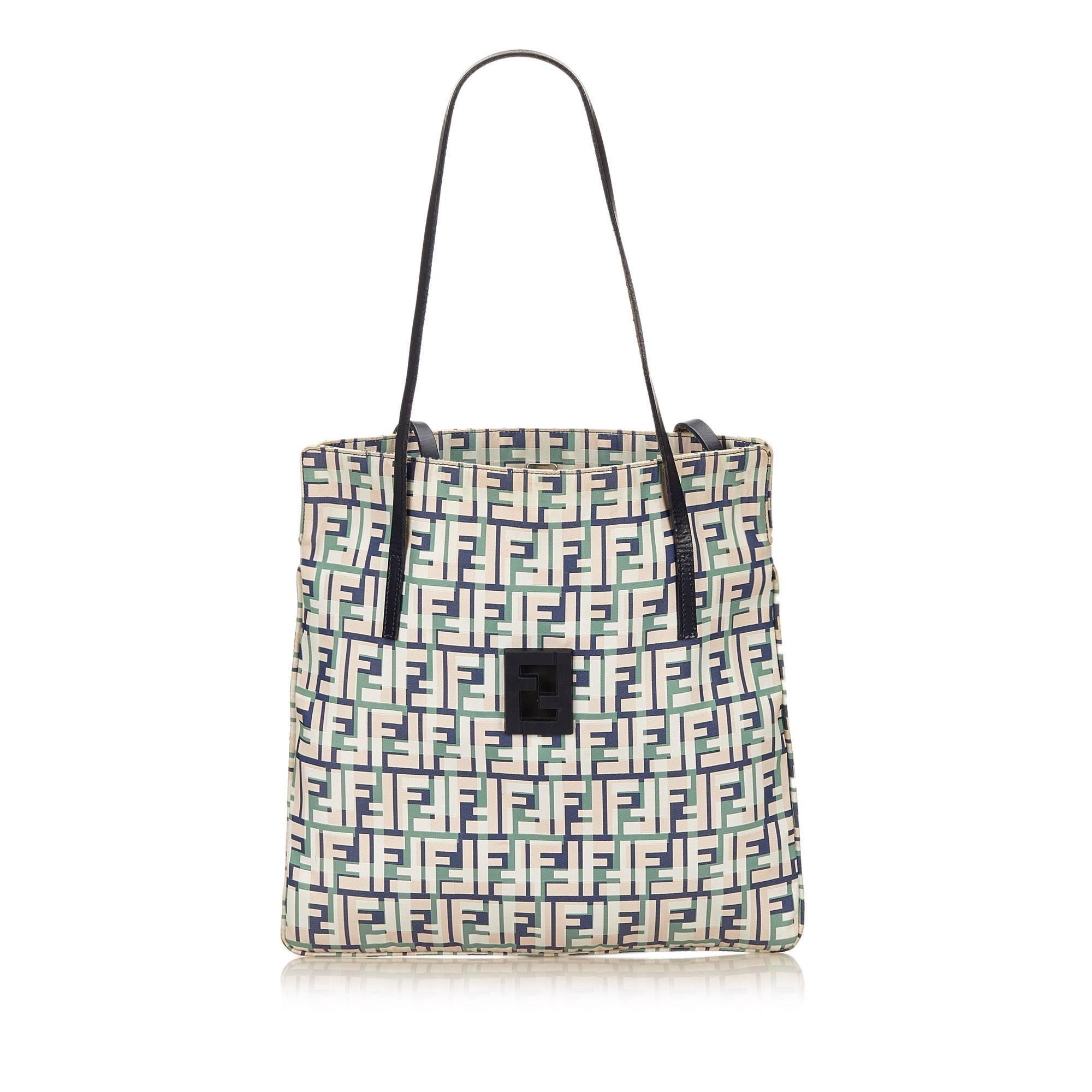 Product details:  Multicolor Zucca-printed canvas tote bag by Fendi.  Dual leather shoulder straps.  Open top.  Lined interior with inner zip pocket.  13