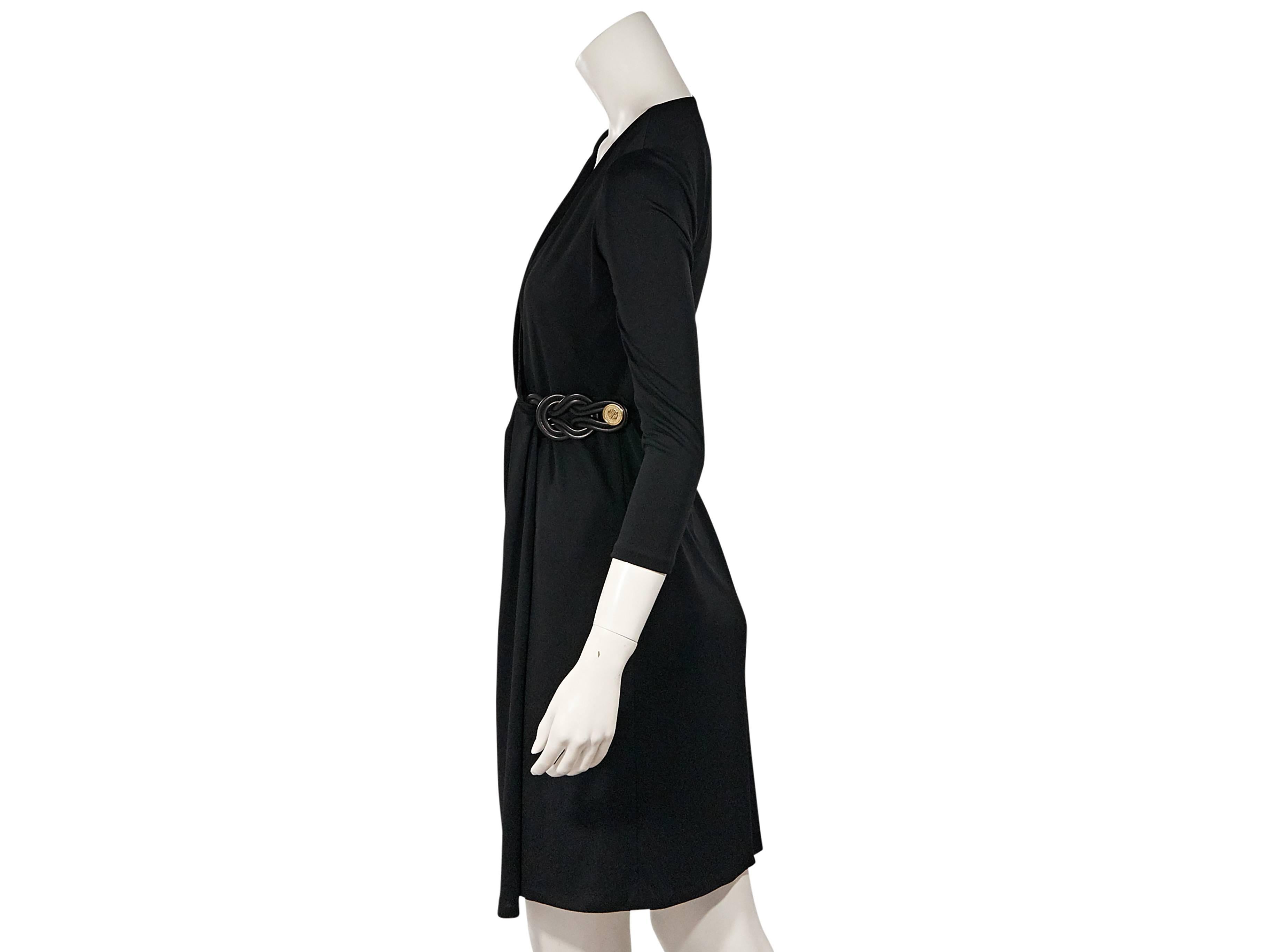 Product details:  Black wrap dress by Gucci.  V-neck.  Three-quarter length sleeves.  Button closure.  Label size IT 38.   
Condition: New with tags. 
Est. Retail $ 1,995.00