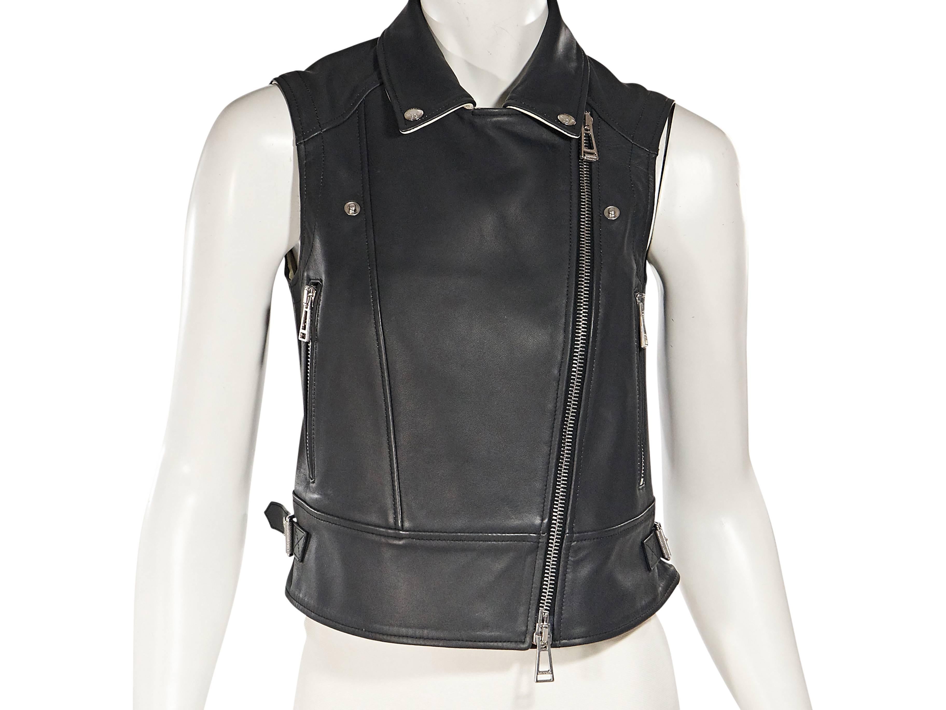 Product details:  Black leather moto vest by Belstaff.  Button-down collar.  Sleeveless.  Asymmetrical zip front.  Side zip pockets.  Side hem buckle accents.  Silvertone hardware.  Label size IT 38.    
Condition: Excellent. 
Est. Retail $ 1,495.00