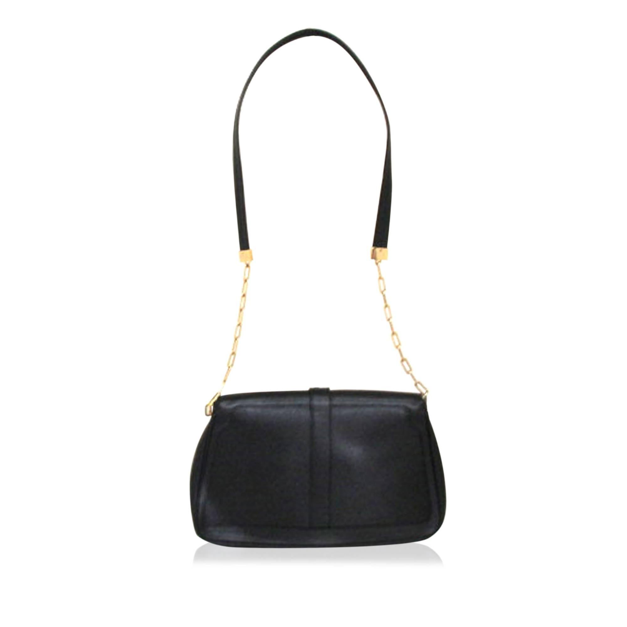 Product details:  Black leather shoulder bag by Gucci.  Leather and chain shoulder strap.  Front flap with magnetic snap closure.  Dual exterior zip pockets.  Lined interior with inner zip pocket.  Goldtone hardware.  12.25