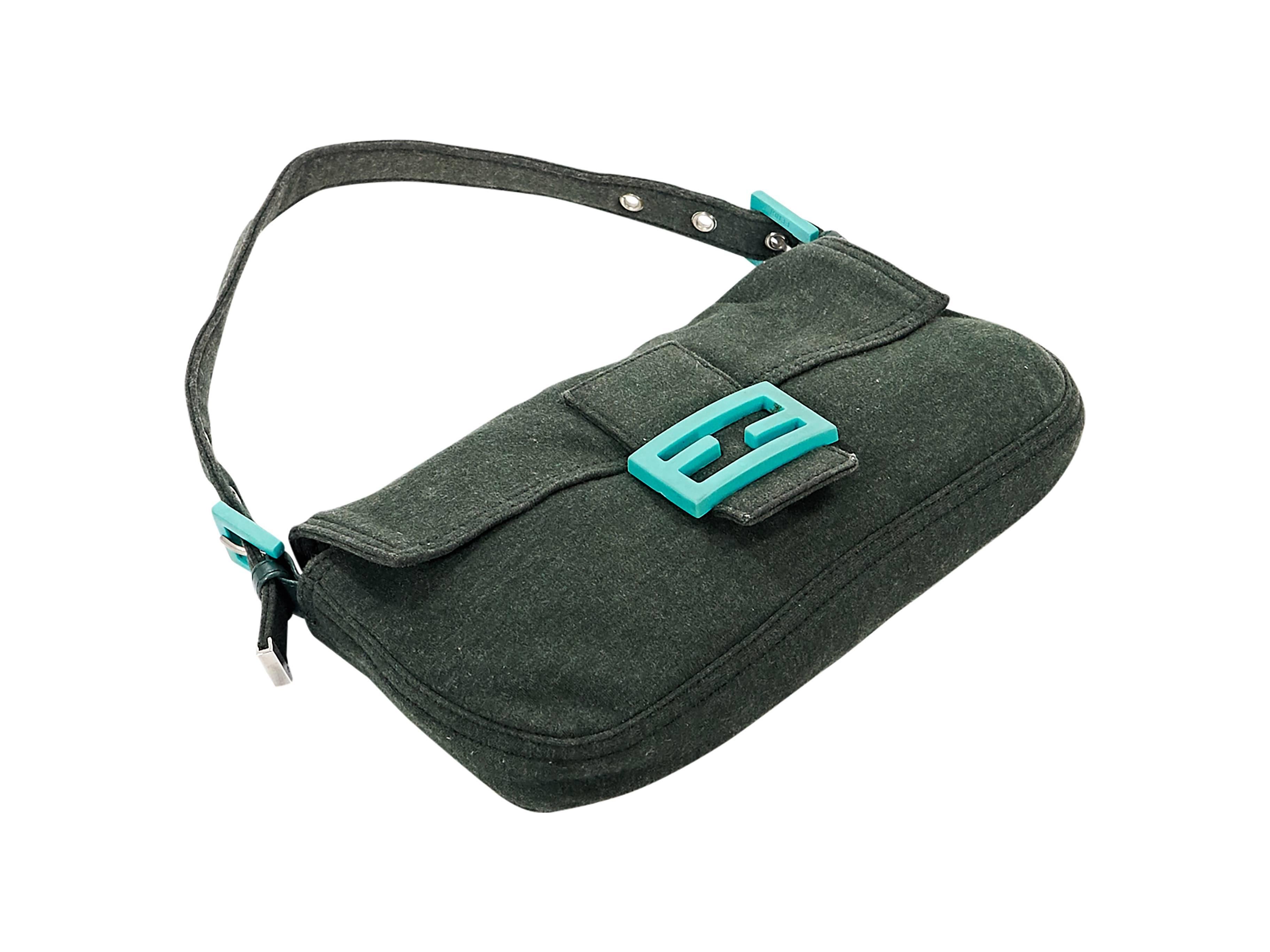 Product details: Green cotton baguette shoulder bag by Fendi. Single adjustable shoulder strap. Front flap. Lined interior with inner zip pocket. Neon teal accents. 10