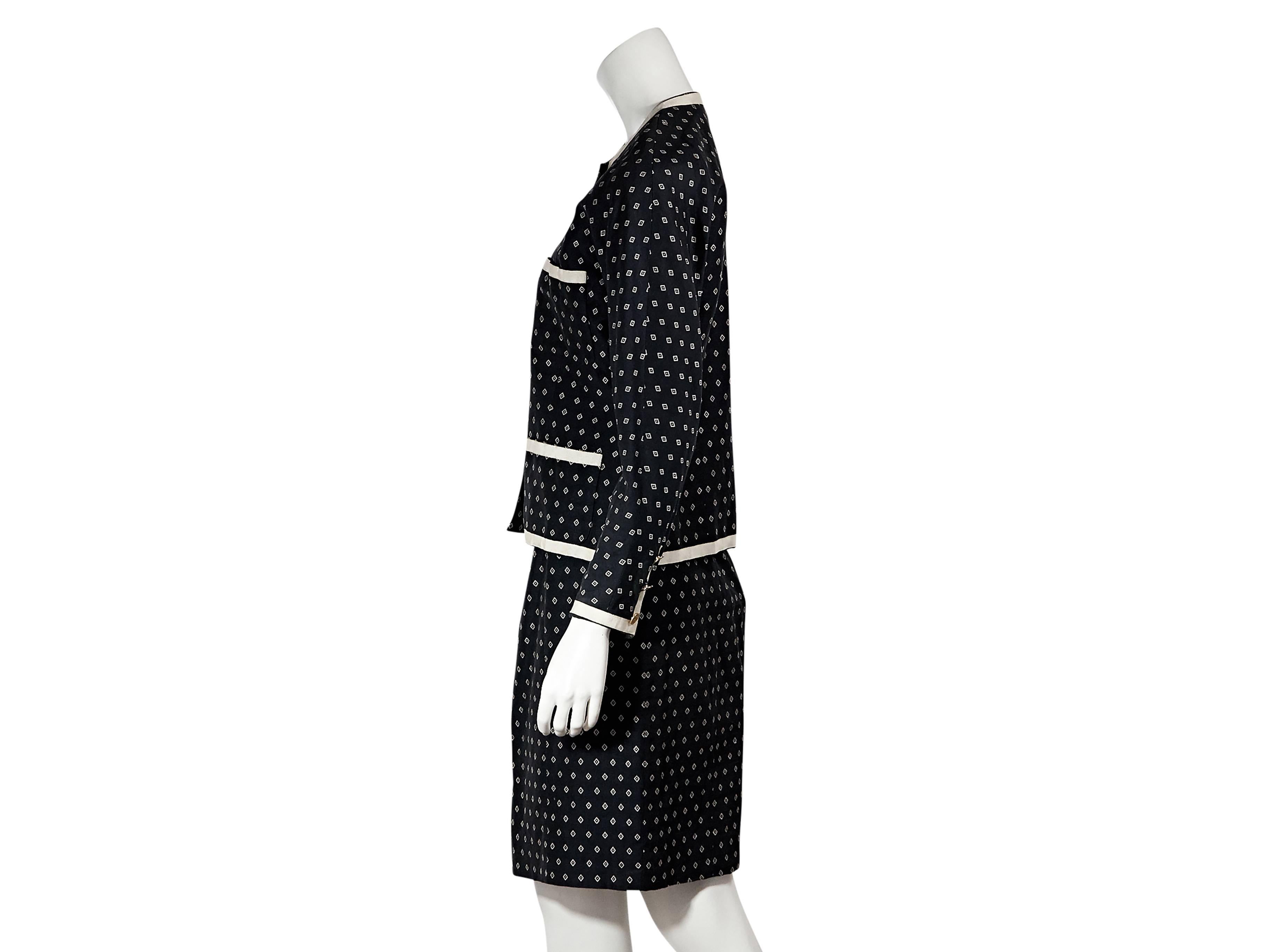 Product details: Vintage navy and white diamond printed skirt suit by Chanel. Crewneck. Long sleeves. Button-front closure. Front patch pockets. Matching pencil skirt. Concealed back zip closure. 
Condition: Very good. 
Est. Retail $ 1,628.00