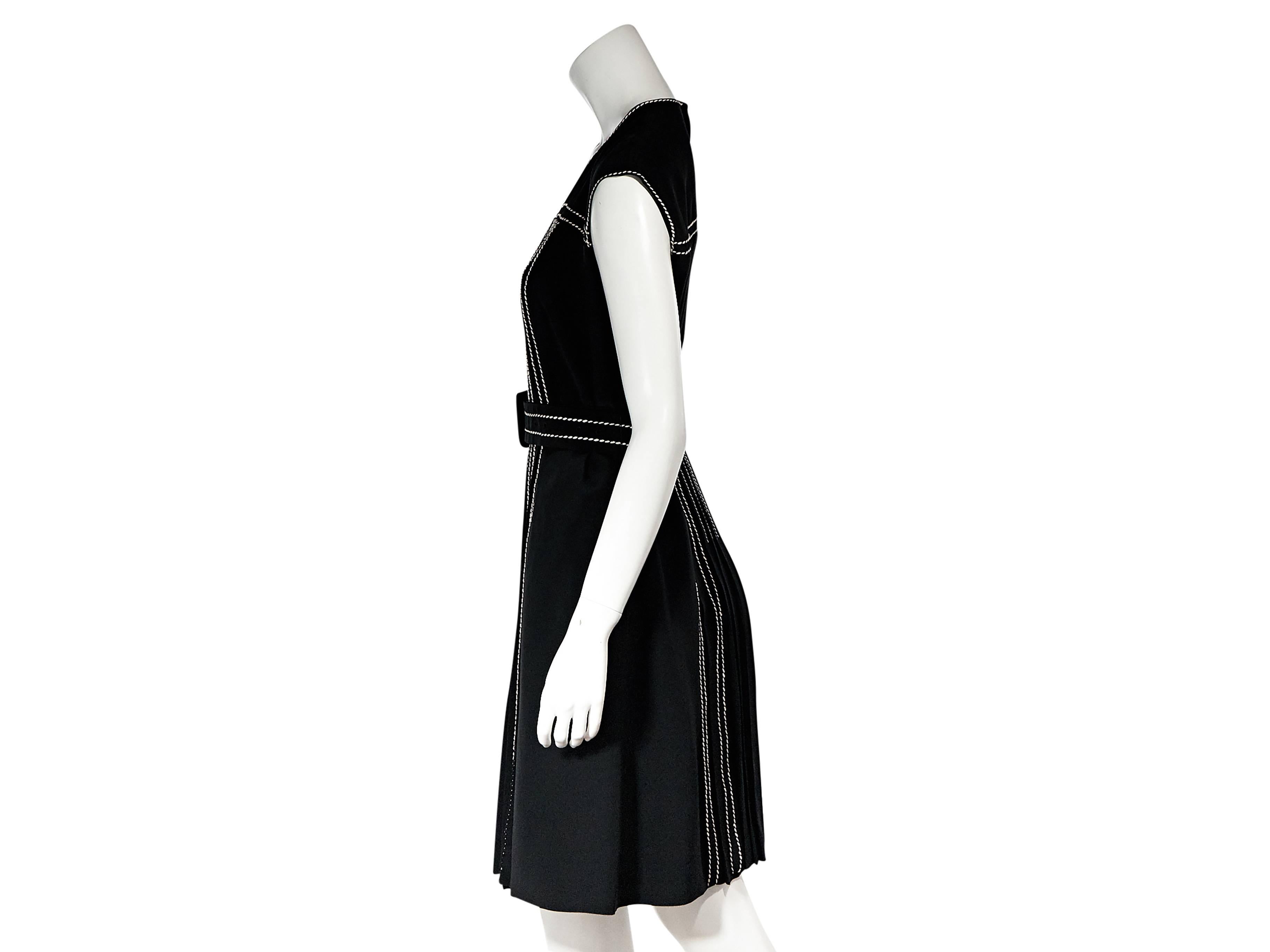 Product details: Black silk belted dress by Prada. Accented with topstitching and front pleats. Jewelneck. Cap sleeves. Adjustable belted waist. Back button closure with keyhole cutout. 
Condition: New with tags. 
Est. Retail $ 1,600.00