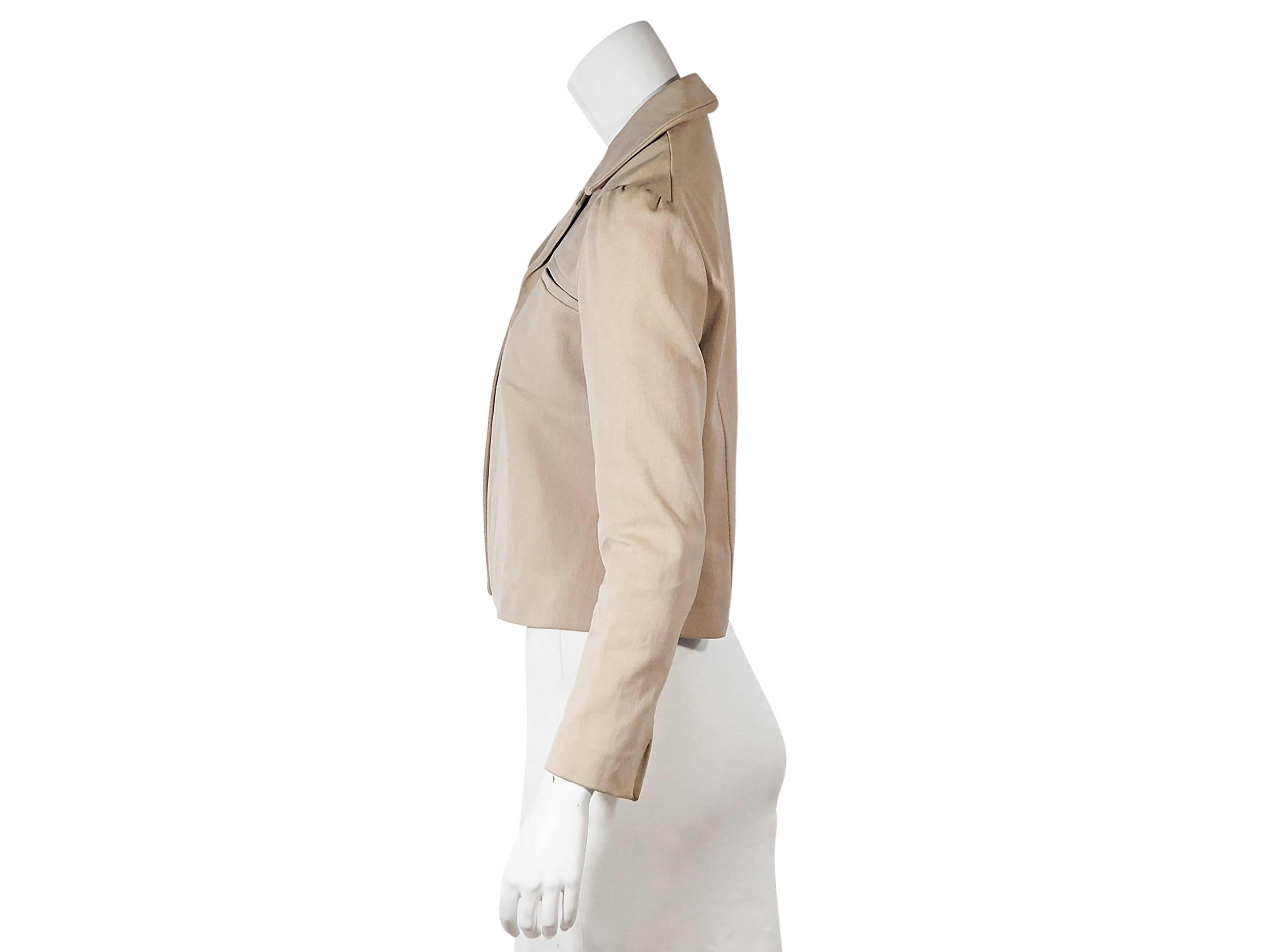 Product details:  Tan jacket by Marni.  Notched collar.  Long sleeves.  Slit cuffs.  Besom chest pocket.  Open front.  
Condition: Very good. 
Est. Retail $ 598.00