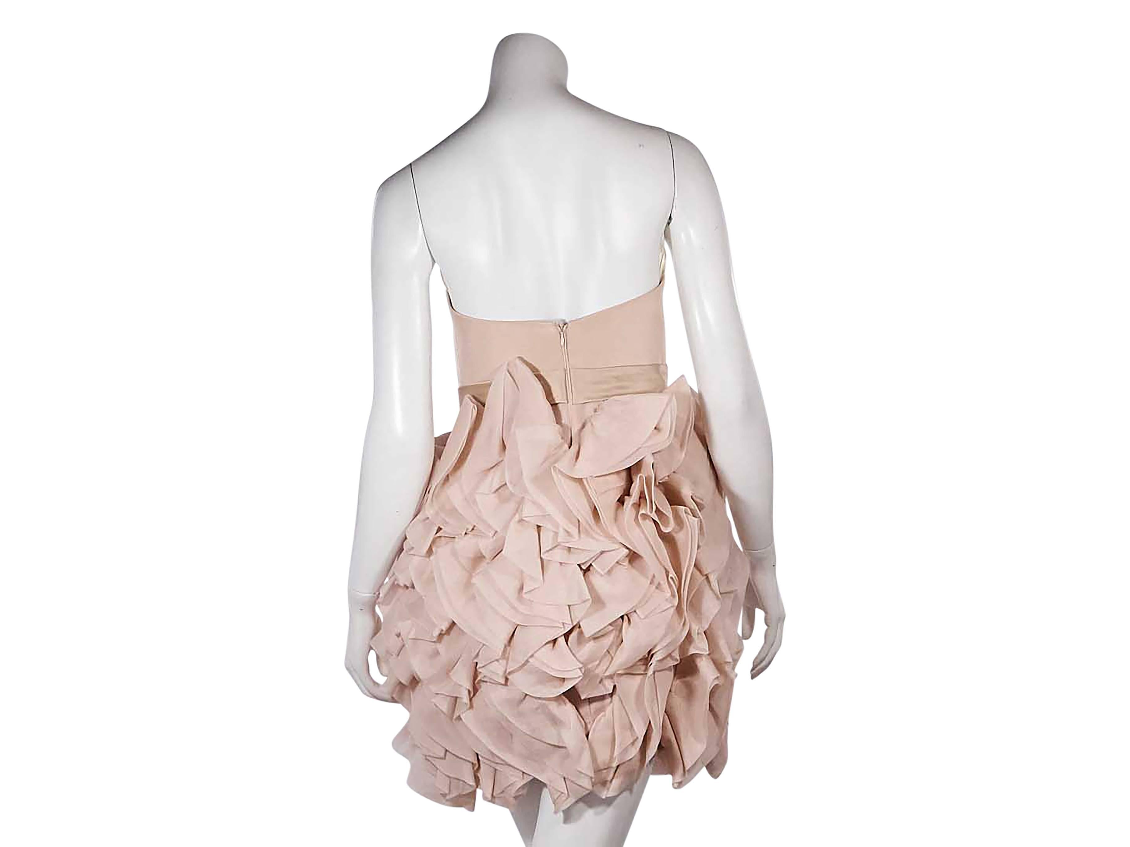 Product details:  Blush pink strapless mini dress by Marchesa Notte.  Sweetheart neckline.  Fitted bodice.  Banded waist.  Ruffled skirting.  Concealed back zip closure. 
Condition: Very good.
Est. Retail $ 628.00
US Size 6