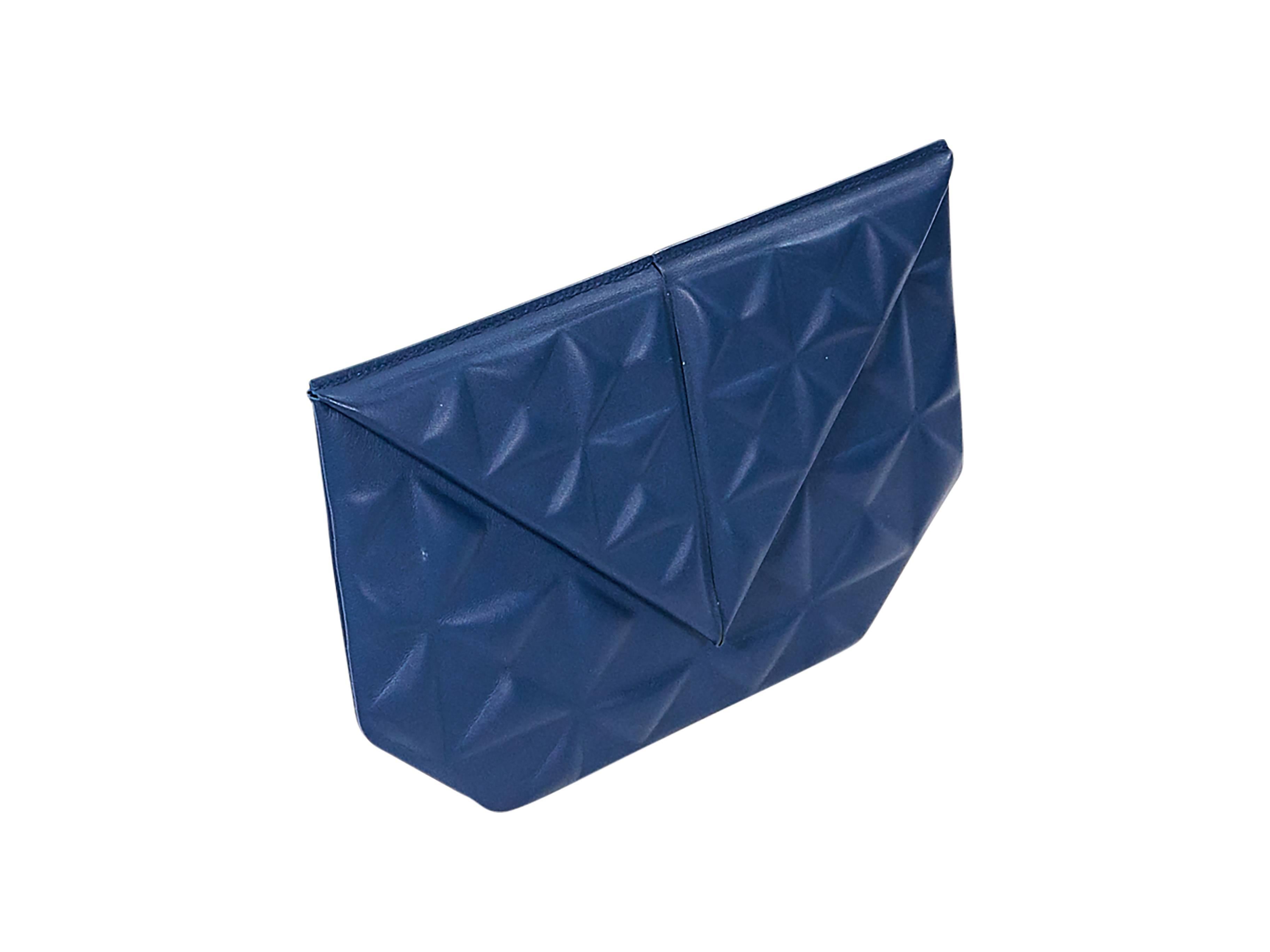 Product details:  Blue embossed leather Classico II clutch by Roland Mouret.  Exterior zip pocket over front flap.  Origami-style front flap.  Hidden magnetic closure.  Lined interior with inner zip pocket.  10"L x 6.75"H x 0.5"D.