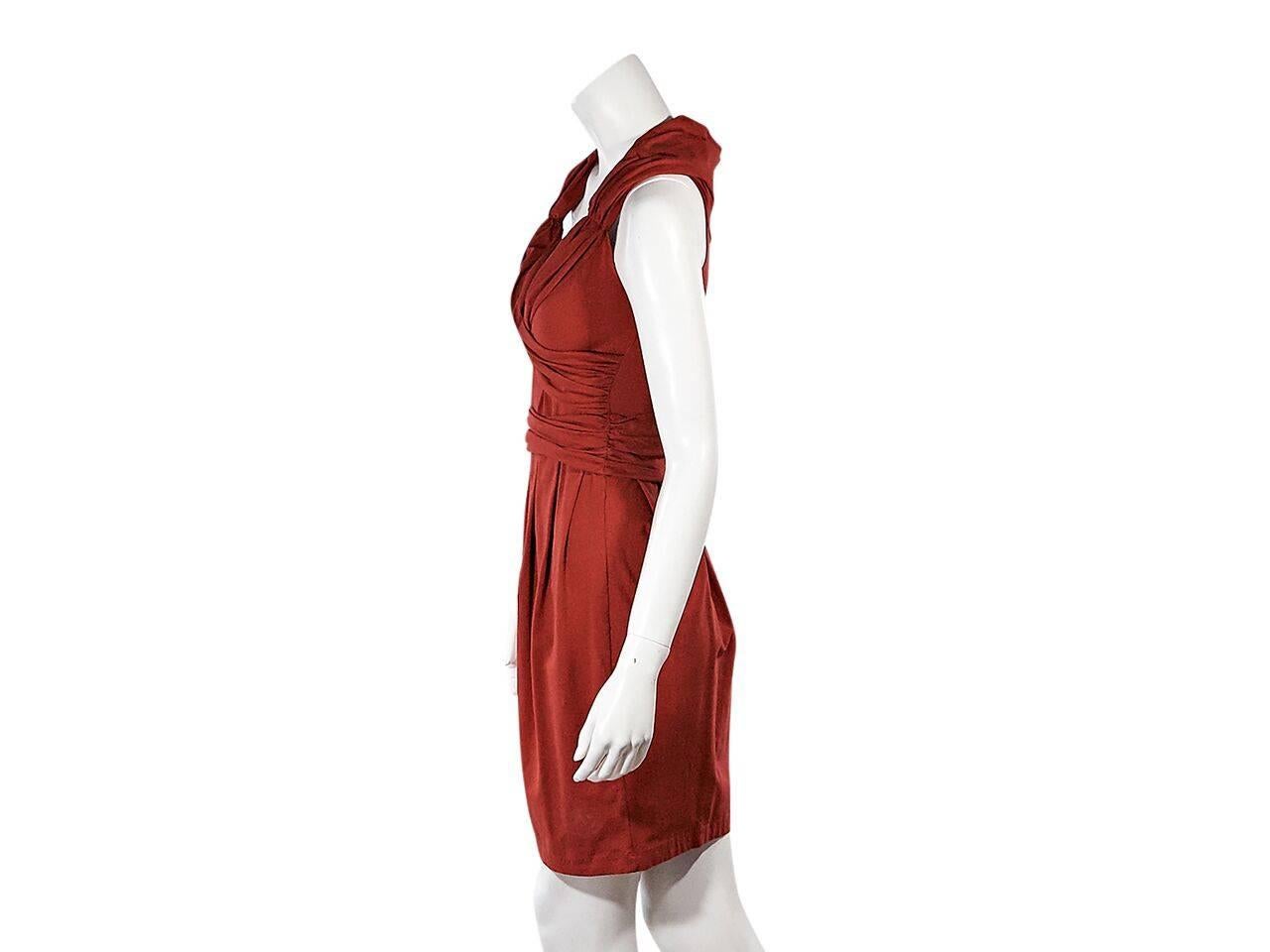 Product details:  Red gathered dress by Prada.  Scoponeck.  Faux wrap bodice.  Gathered waist.  Pleated skirting.  Pullover style.  
Condition: Pre-owned. Very good.
Est. Retail $ 978.00