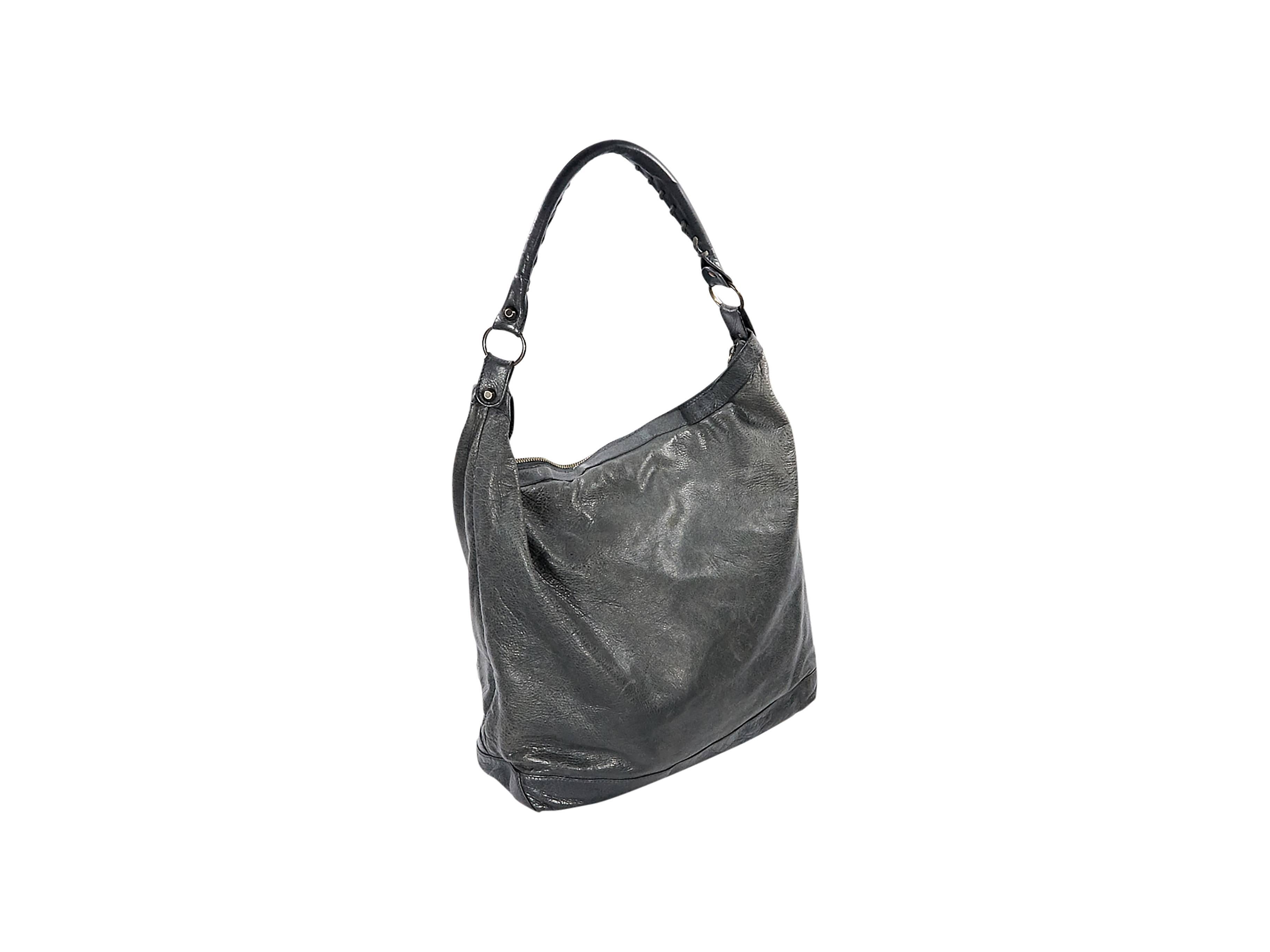 Product details:  Grey leather Moto shoulder bag by Balenciaga.  Single shoulder strap.  Top zip closure.  Lined interior with inner zip pocket.  Front exterior zip pocket.  Antiqued goldtone hardware.  13.75"L x 14"H x 5.5"D. 
