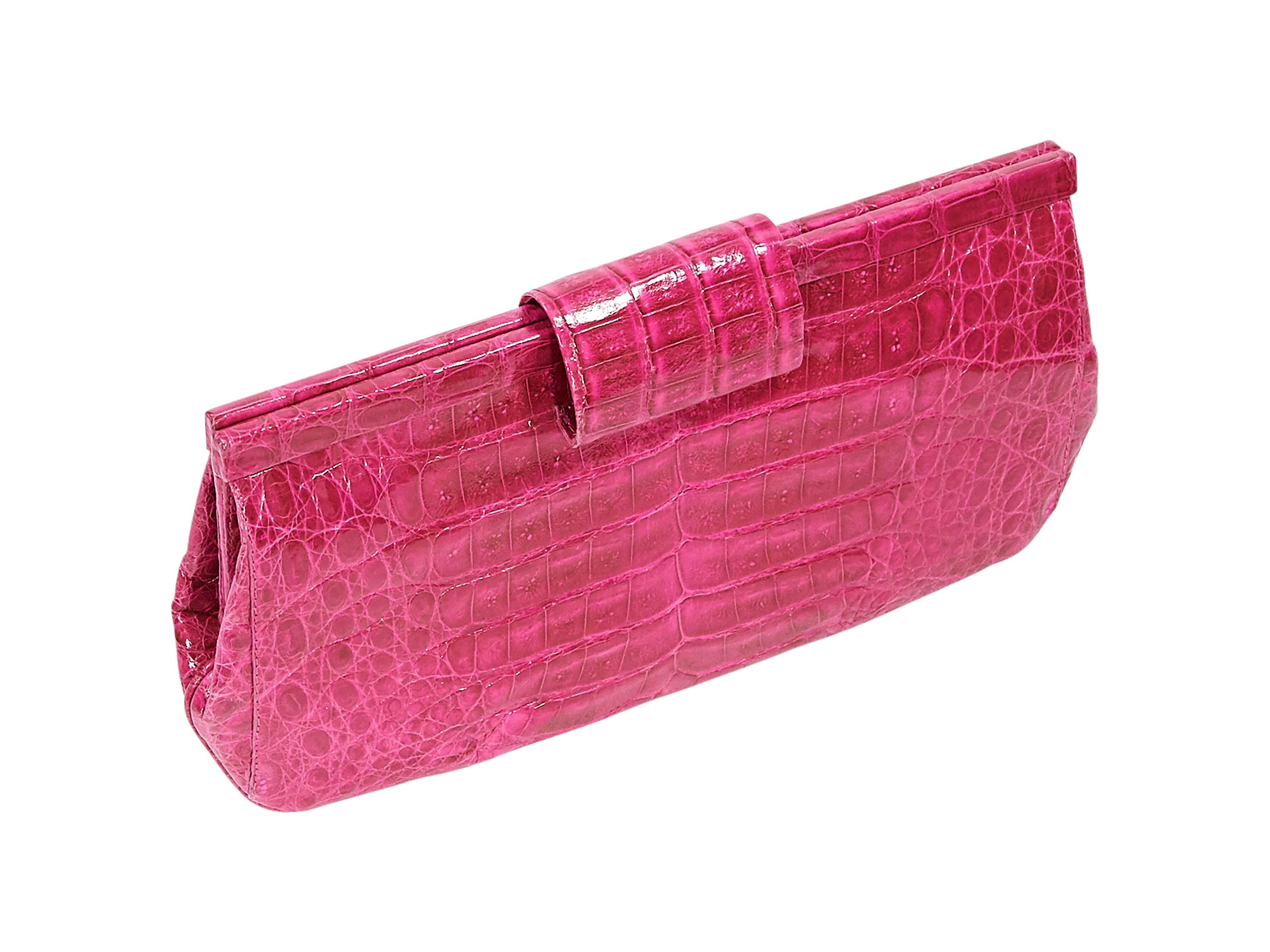 Product details:  Exotic magenta crocodile clutch by Nancy Gonzalez.  Top strap closure.  Lined interior with inner zip and slide pockets.  10.25"L x 5"H x 1.2"D.
Condition: Pre-owned. Very good.

Est. Retail $ 2,000.00
