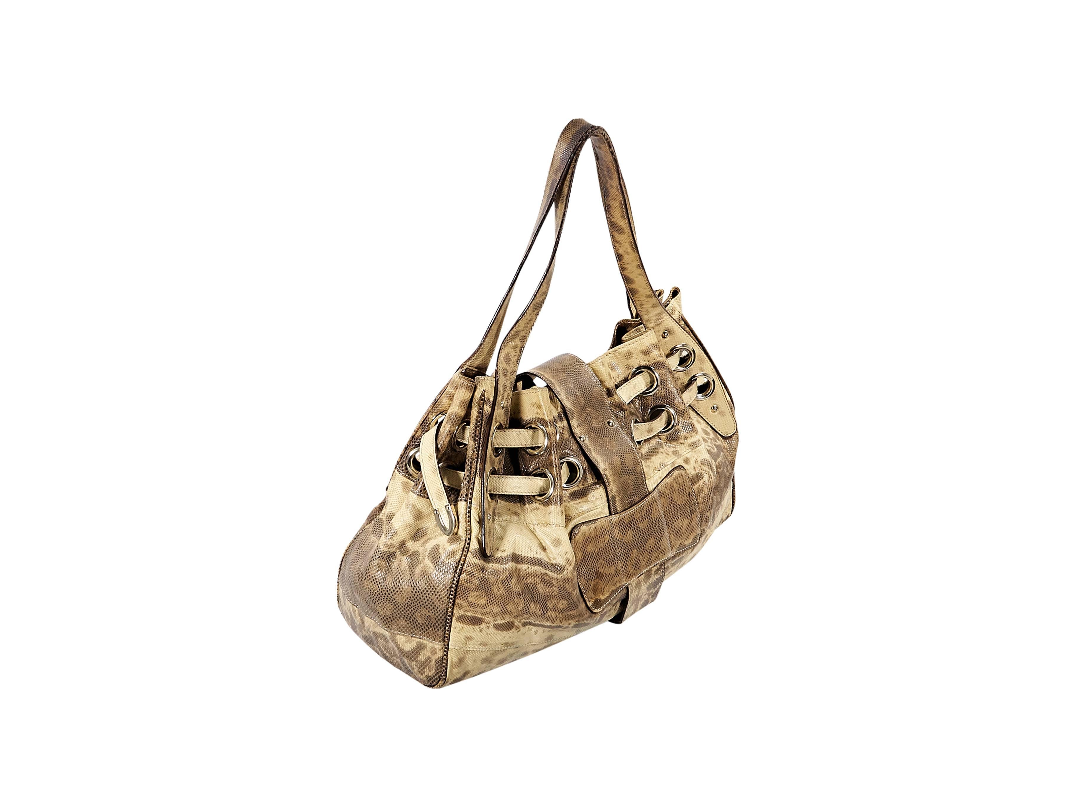 Product details: Beige snakeskin Ramono shoulder bag by Jimmy Choo. Dual shoulder straps. Top strap with flip-lock closure. Lined interior with inner zip and slide pockets. Goldtone hardware. 20"L x 15"H x 7.5"D. 12" strap drop.