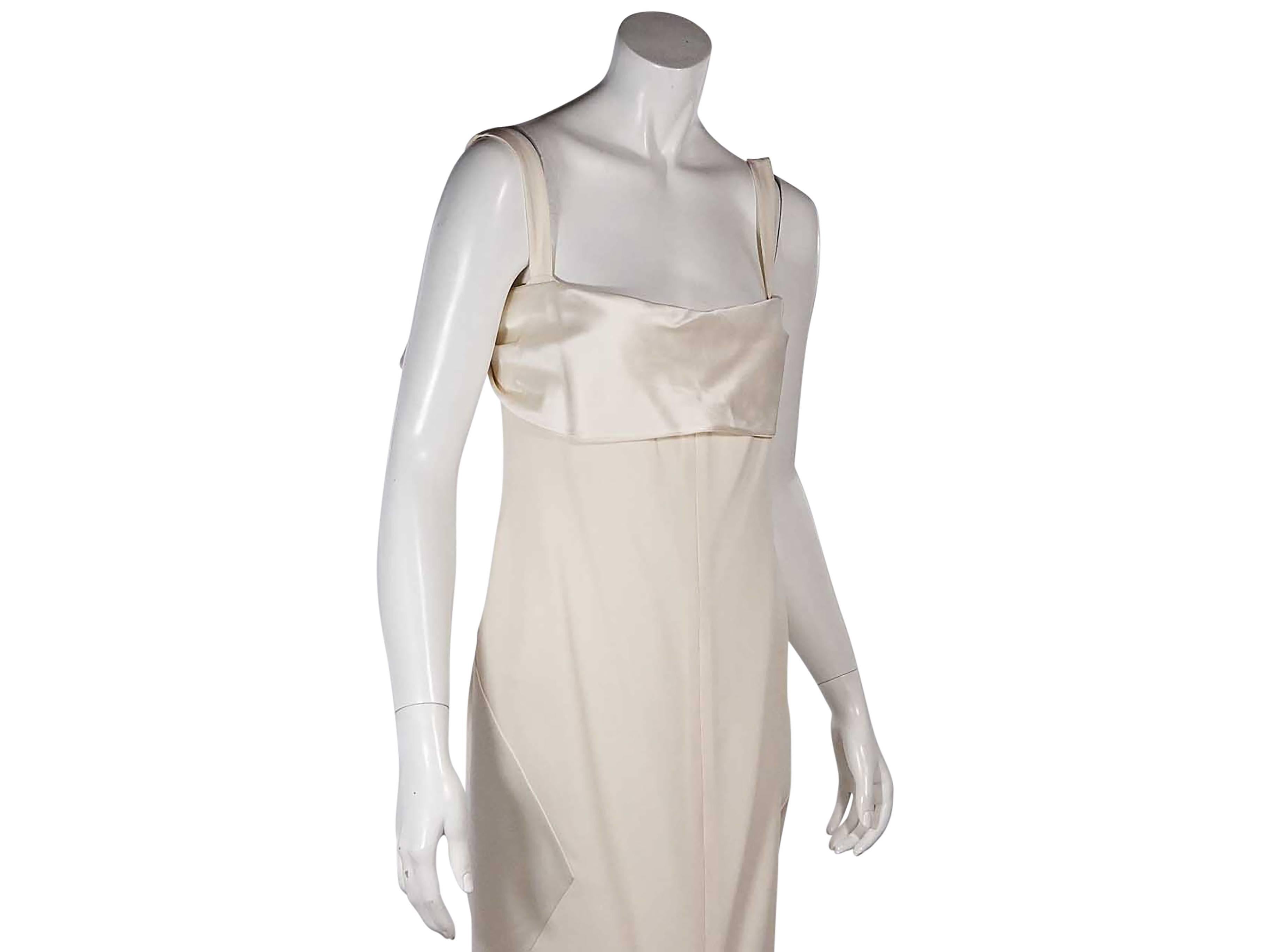 Product details:  Ivory silk Empire waist dress by Valentino.  Sleeveless.  Scoopneck.  Back draped flap.  Concealed back zip closure. 
Condition: New with tags. 

Est. Retail $ 3,180.00