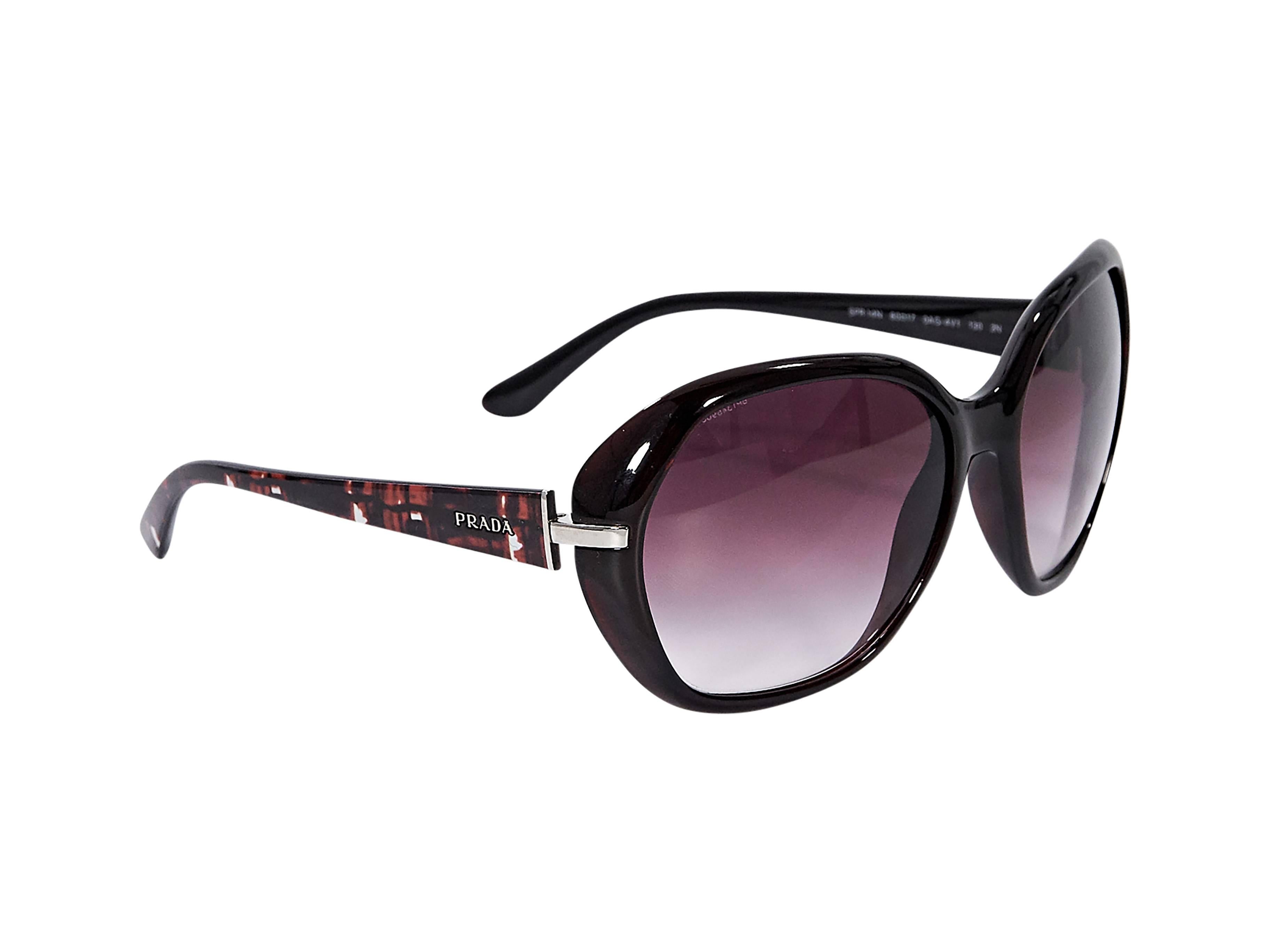Product details: Burgundy sunglasses by Prada. Gradient lenses. Tapered stems. 
Condition: Pre-owned. Very good.

Est. Retail $ 548.00