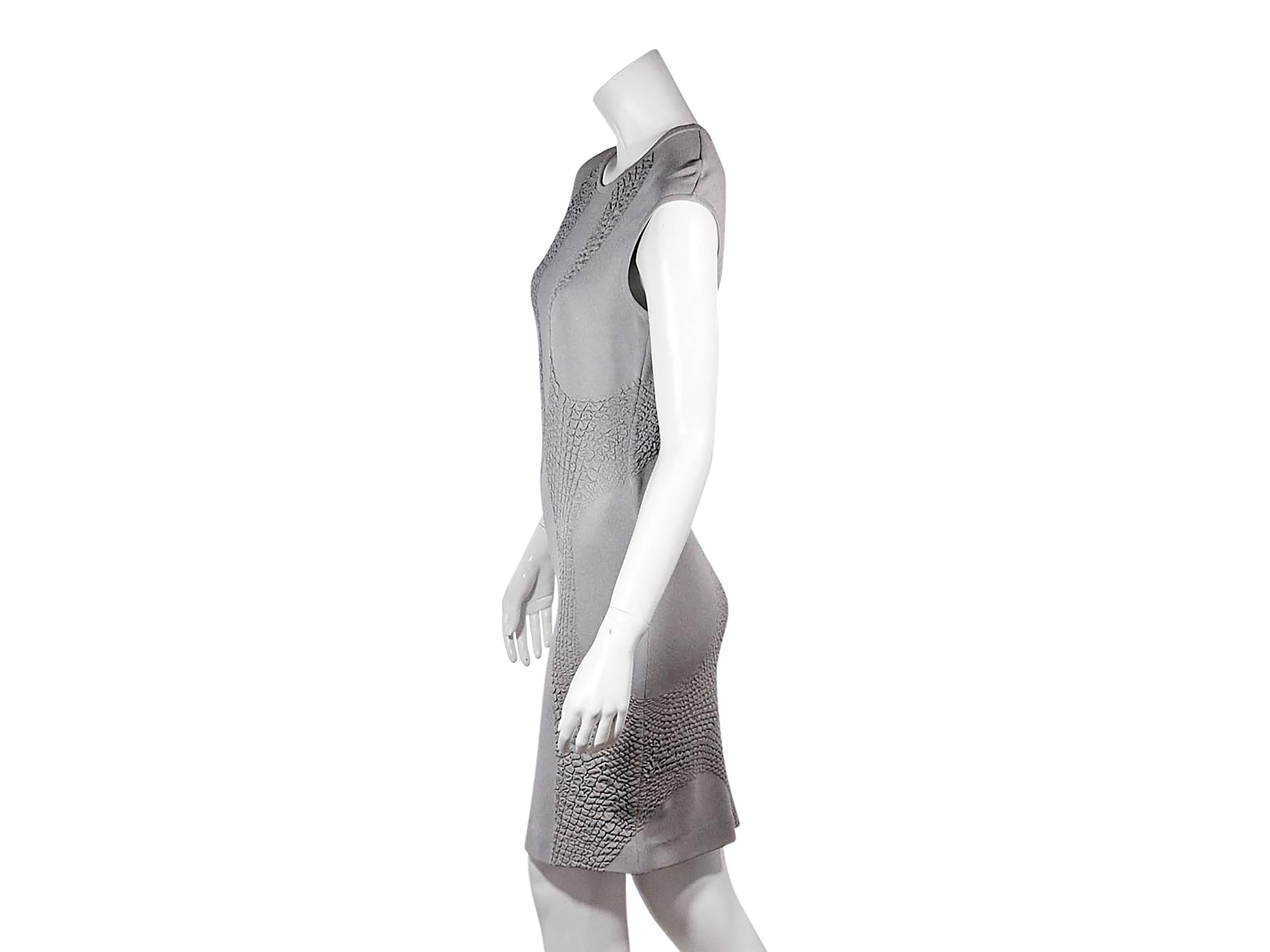 Product details: Grey knit sheath dress by Alexander McQueen. Form-fitting silhouette. Jewelneck. Cap sleeves. Pullover style. 
Condition: Pre-owned. Good. Minor wear on fabric.

Est. Retail $ 1,478.00