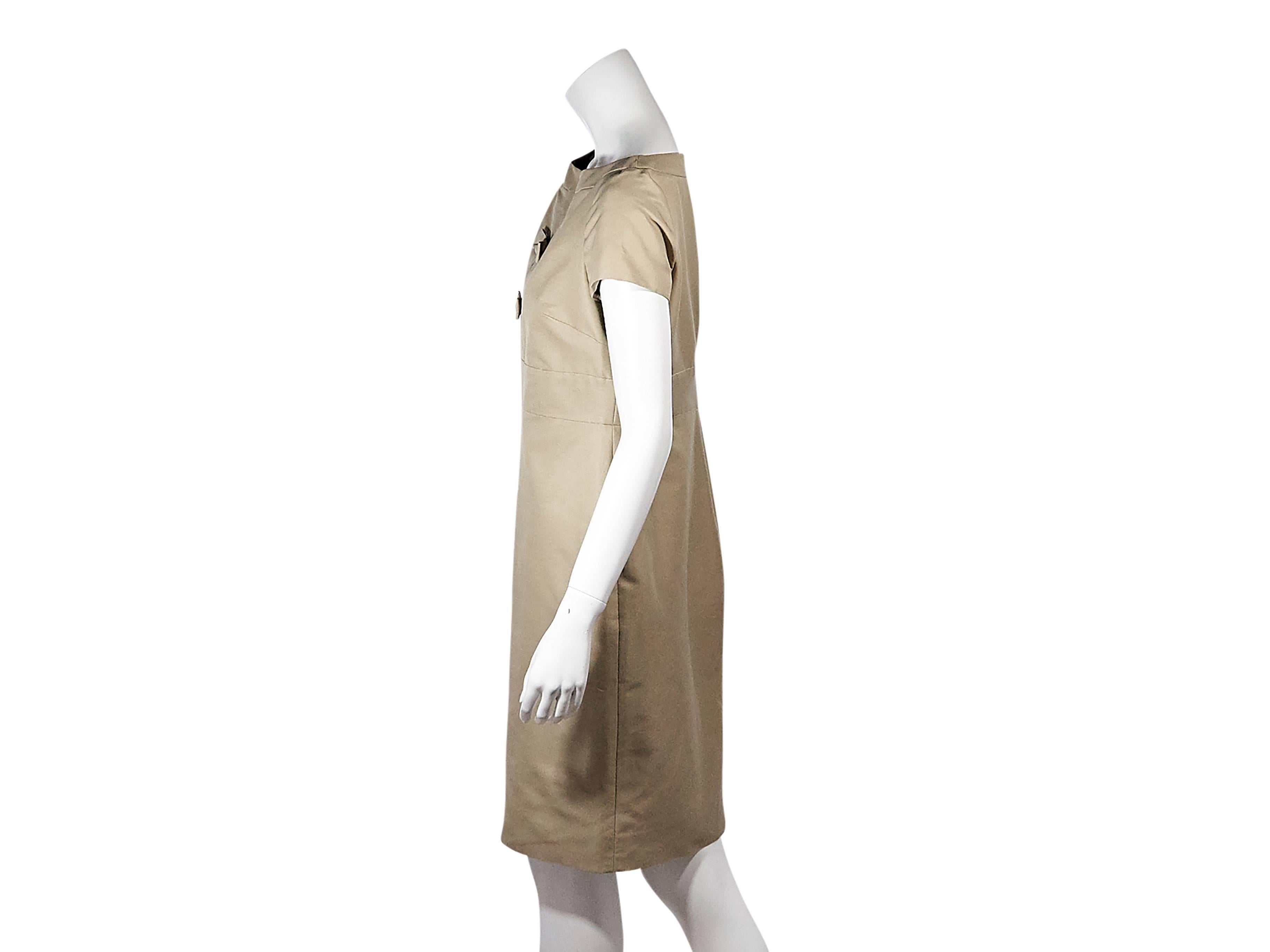 Product details: Tan bow shift dress by Valentino. Boatneck. Short sleeves. Banded Empire waist. Concealed back zip closure. 
Condition: Pre-owned. Very good.

Est. Retail $ 898.00
