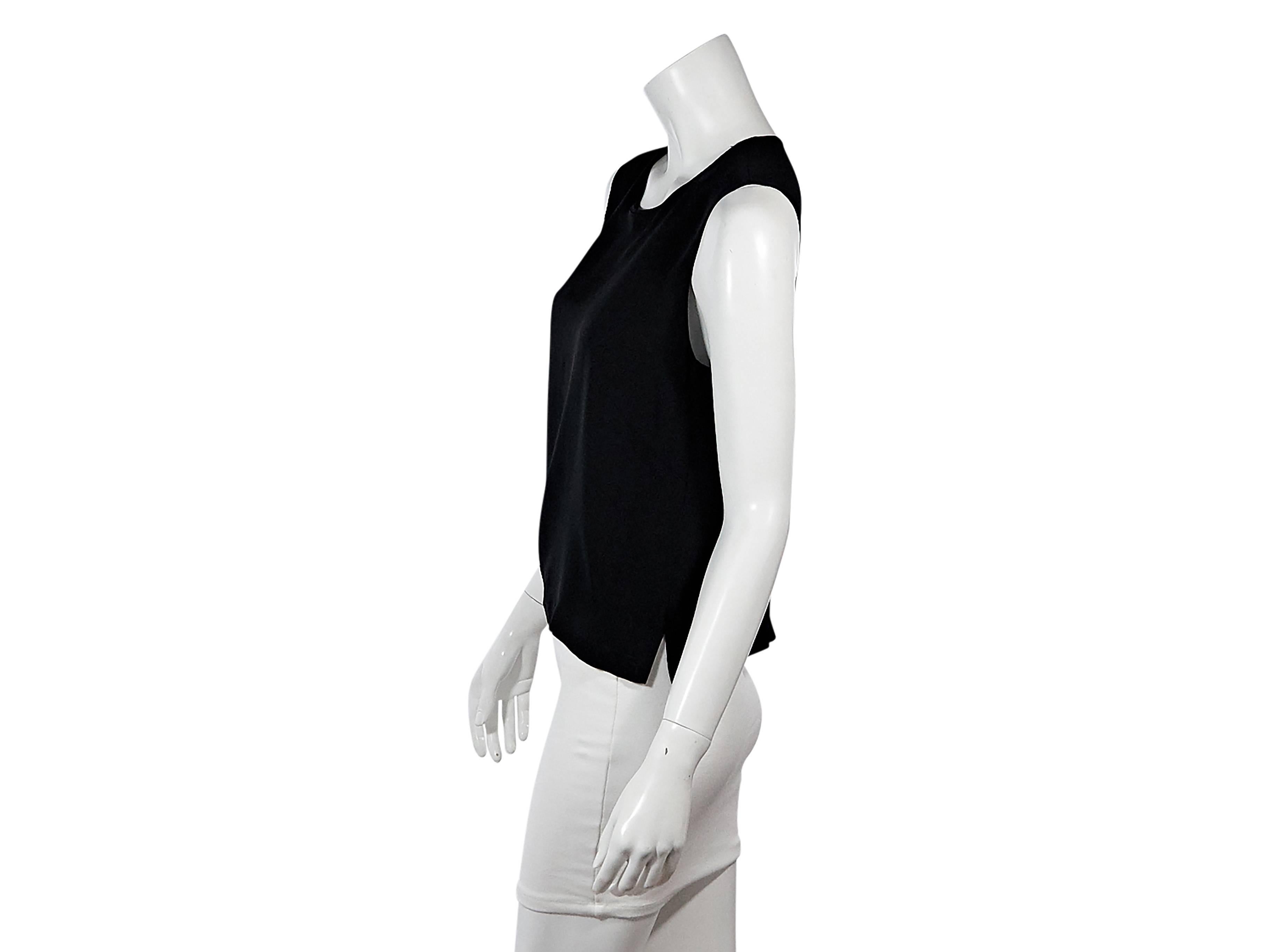 Product details:  Vintage black semi-sheer tank top by Chanel.  Jewleneck.  Sleeveless.  Button back closure.  Tulip hem.  
Condition: Pre-owned. Very good.

Est. Retail $ 1,198.00
