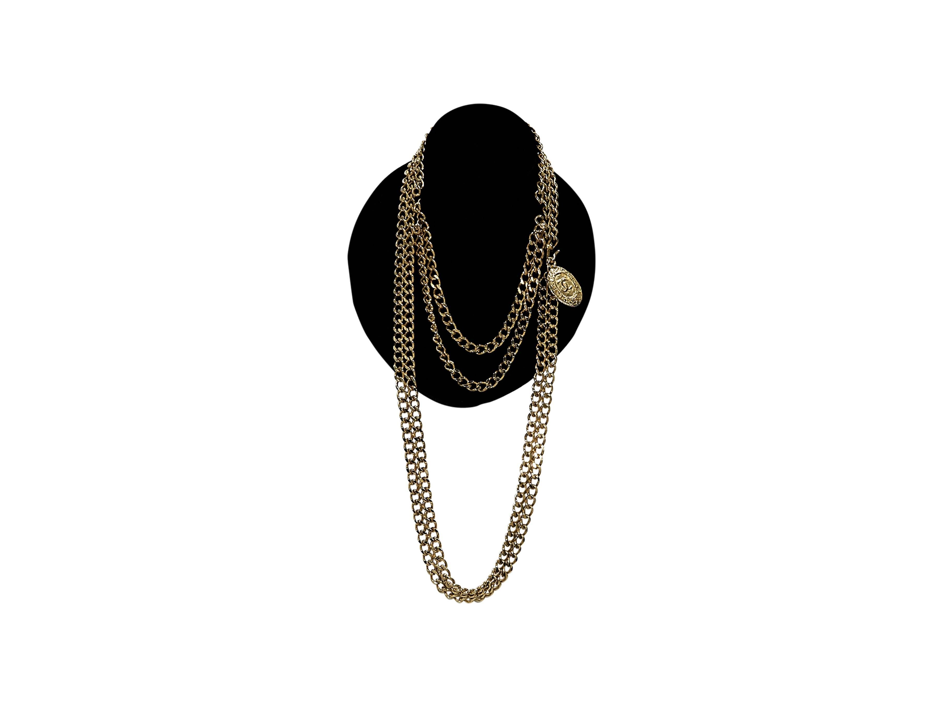 Product details:  Vintage goldtone chain belt by Chanel.  Hook closure.  Accented with a hanging charm.  31