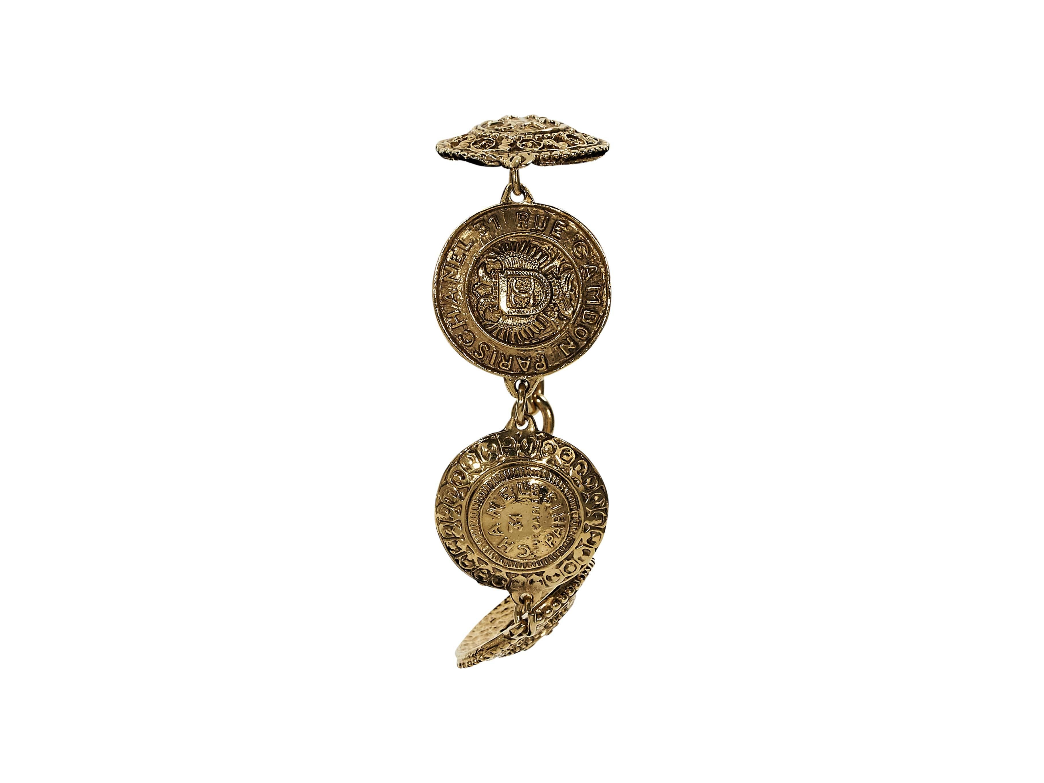 Product details:  Vintage goldtone medallion bracelet by Chanel.  Spring ring closure.  7
