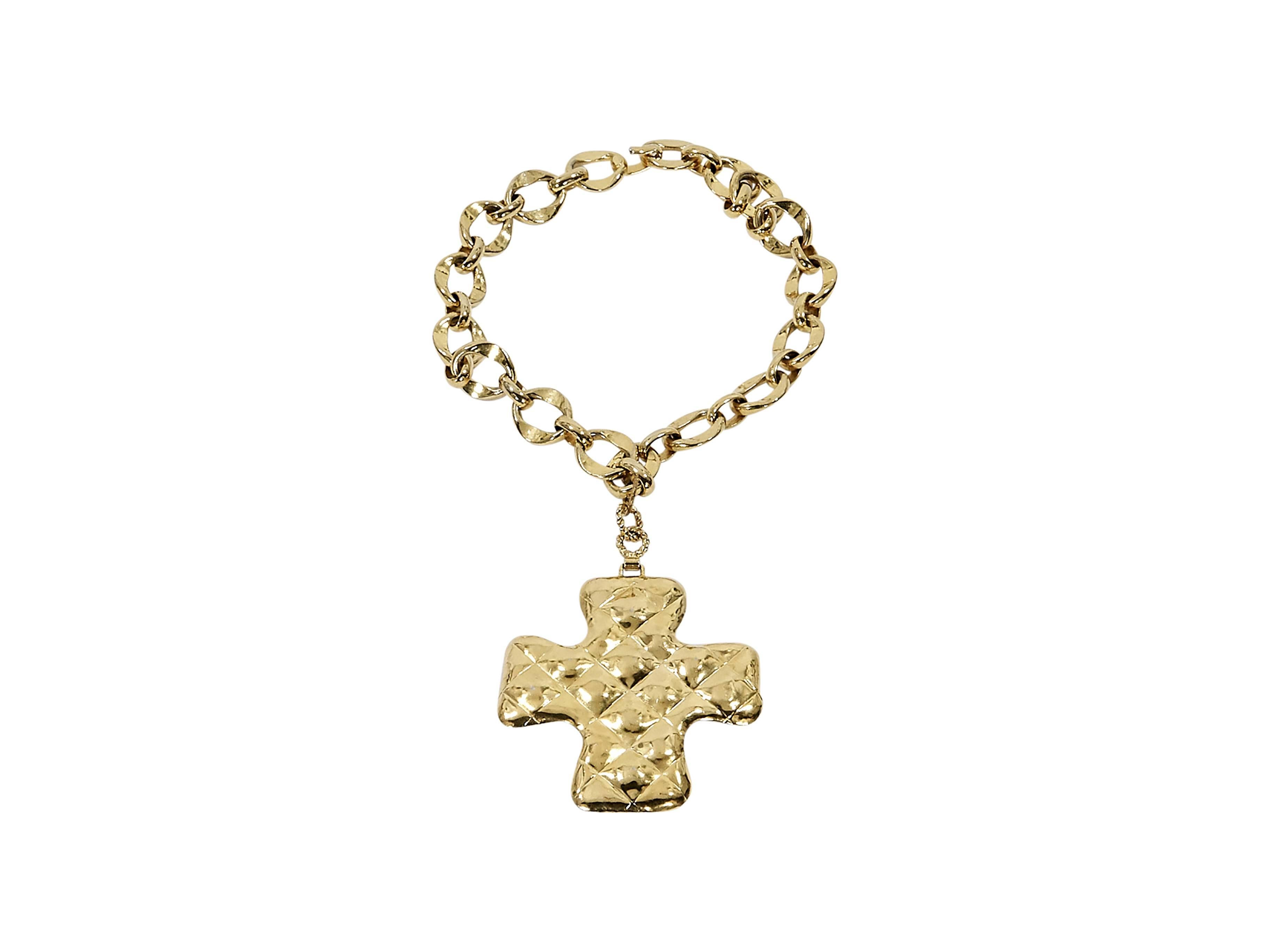 Product details:  Vintage goldtone cross pendant necklace by Chanel.  Large cross pendant.  Hook closure.  17.5