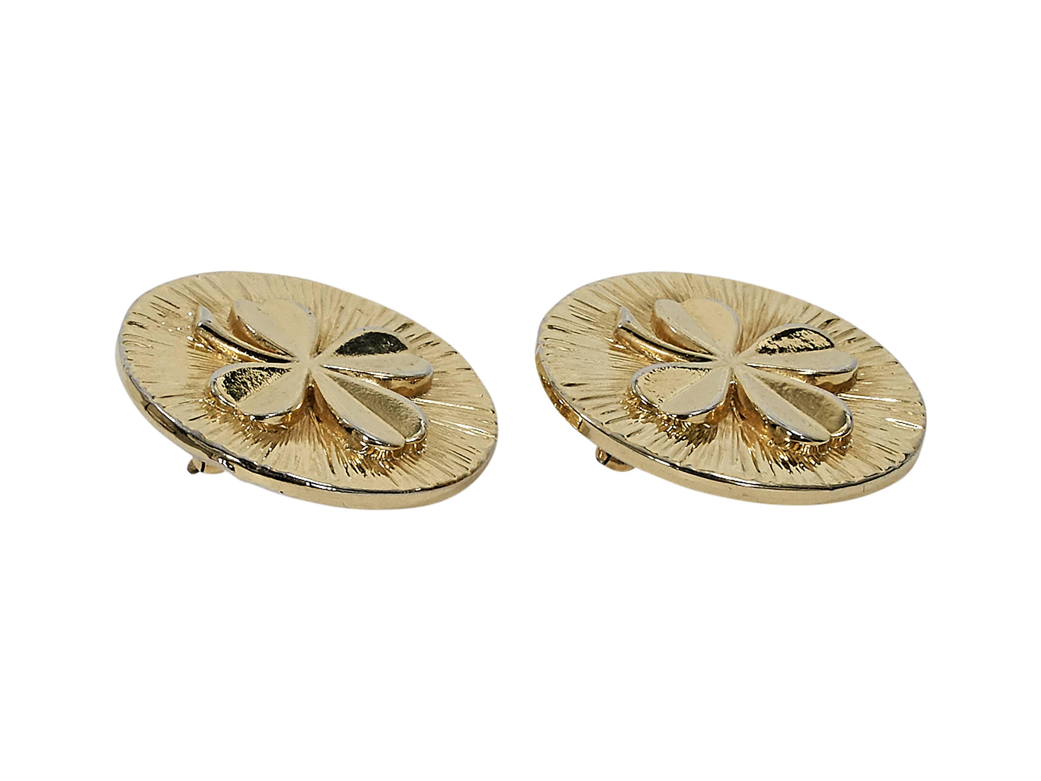 Product details:  Vintage goldtone shamrock earrings by Chanel.  Clip-on backing.  1.5