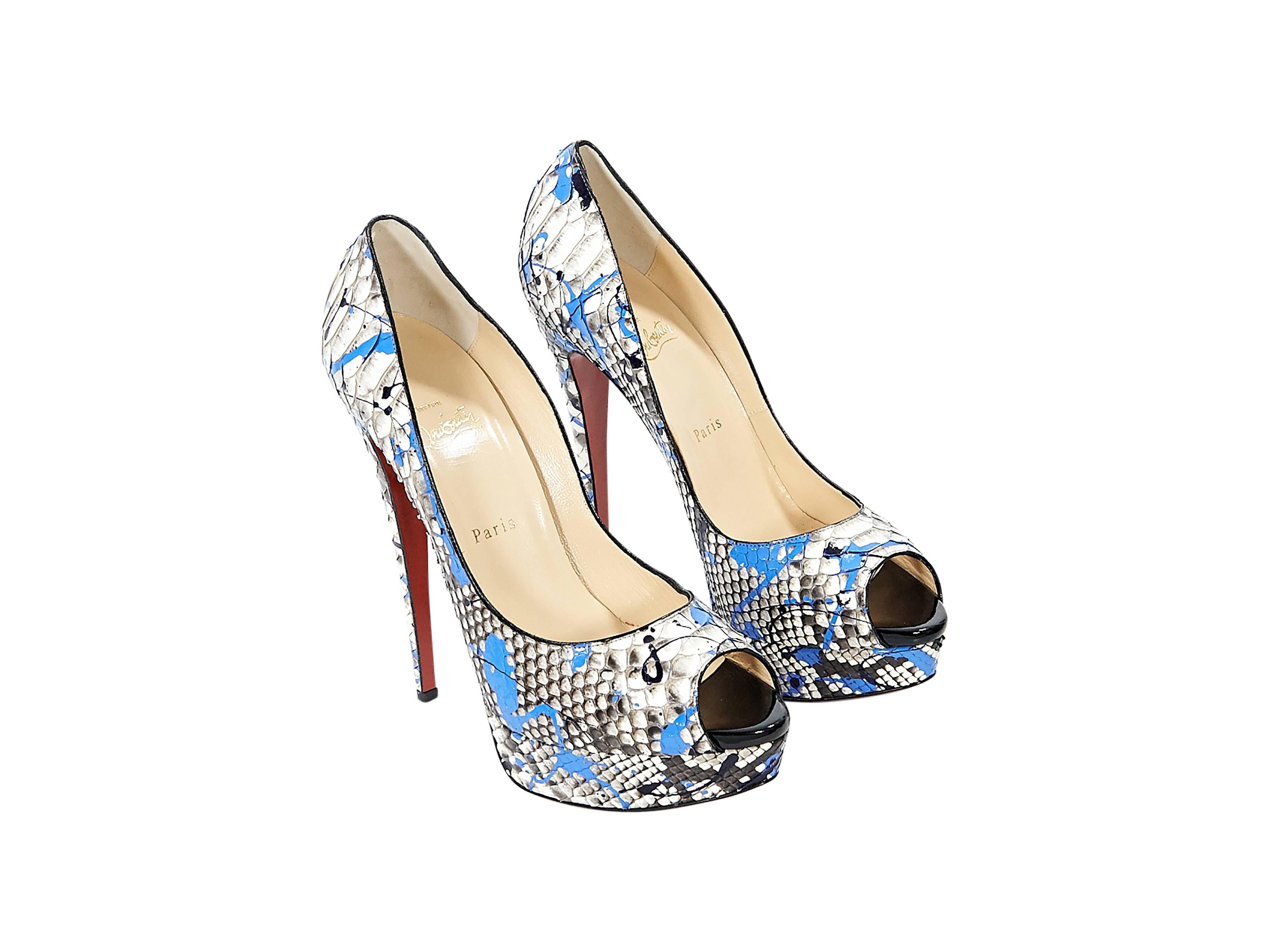 Product details: Multicolor python Lady Graffiti pumps by Christian Louboutin. Peep toe. Towering stiletto and platform design. Iconic red sole. Slip-on style. 
Condition: Pre-owned. Very good.

Est. Retail $ 1,575.00