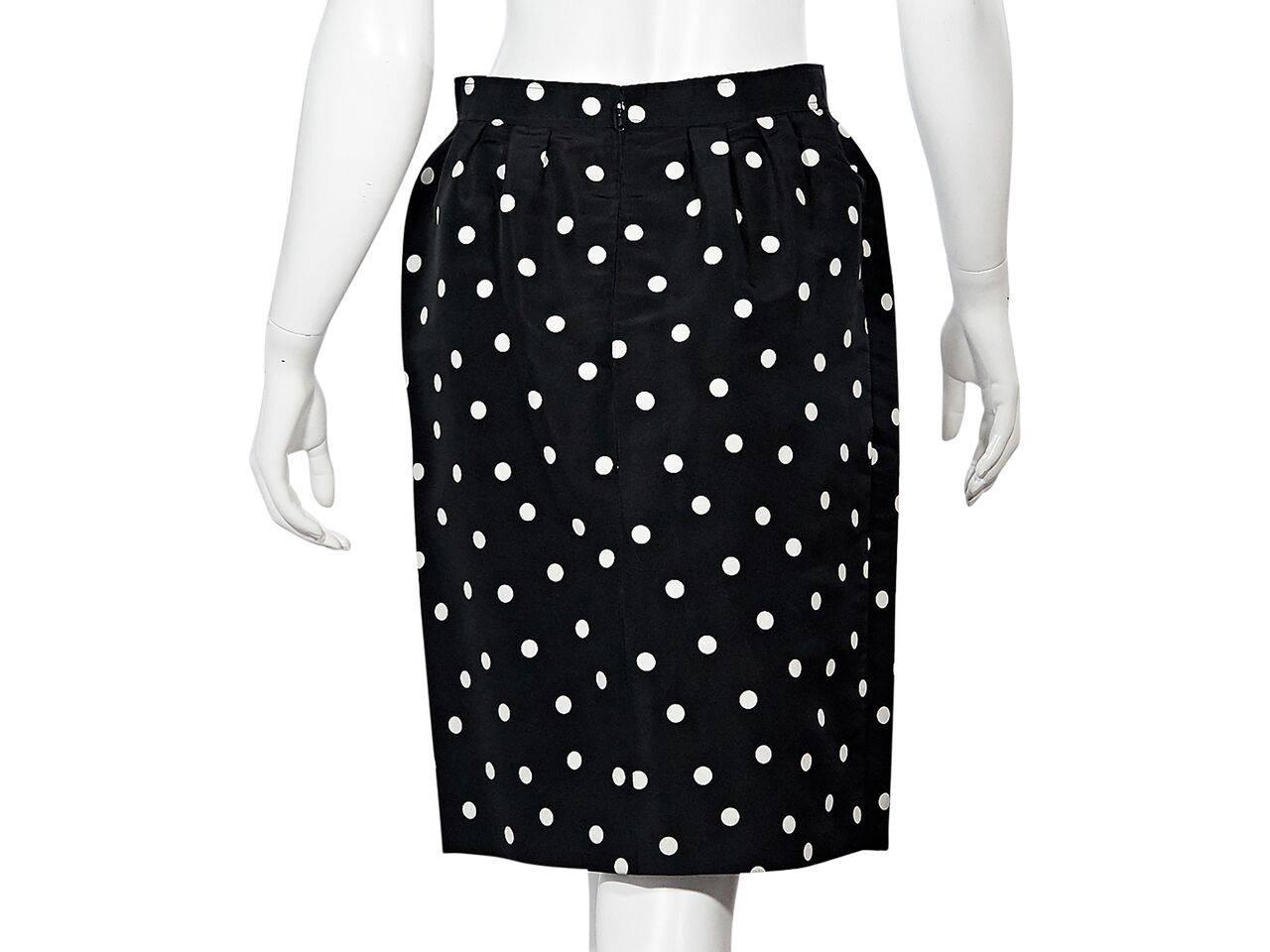 Product details:  Vintage black and white polka dot skirt by Chanel.  Banded waist.  Concealed back zip closure.  
Condition: Pre-owned. Very good.  
Est. Retail $998.00